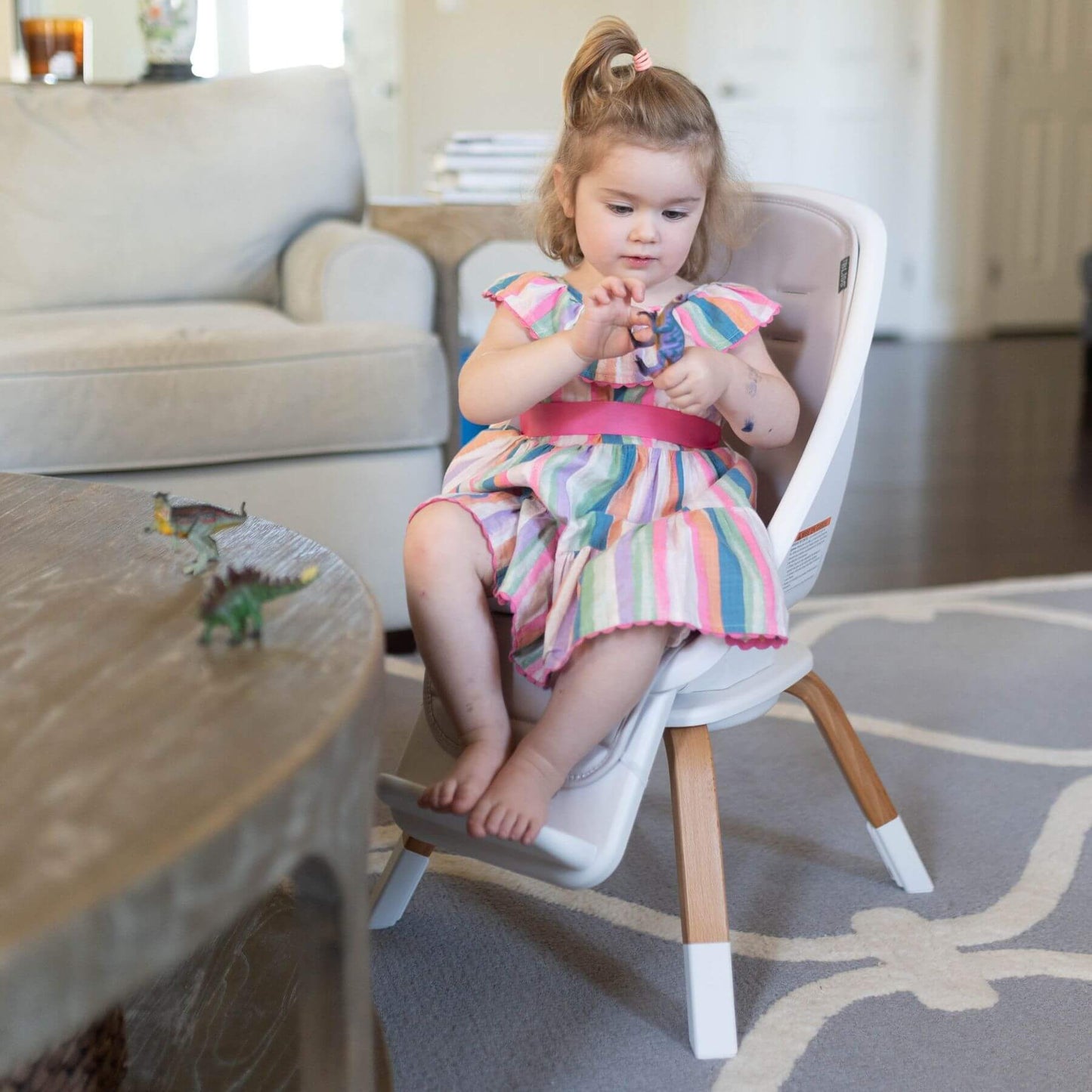 Girl Sitting on TruBliss 2-in-1 Turn-A-Tot Highchair with 360° Swivel