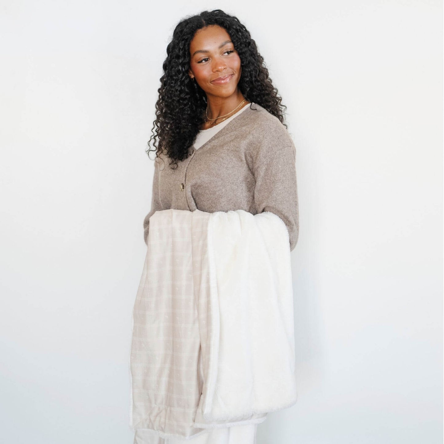 Woman holding Saranoni Minky/Lush Throw Blankets - Ivy