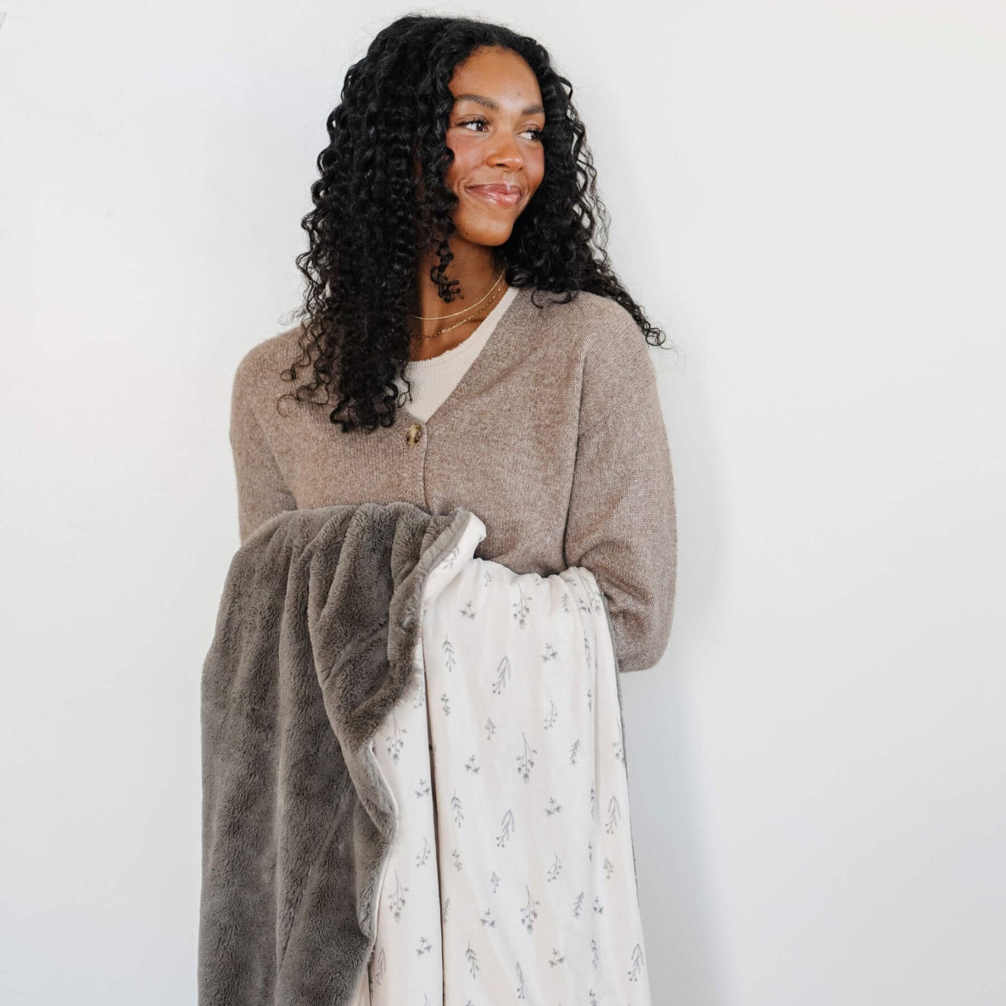 Woman holding Saranoni Minky/Lush Throw Blankets - Jasmine