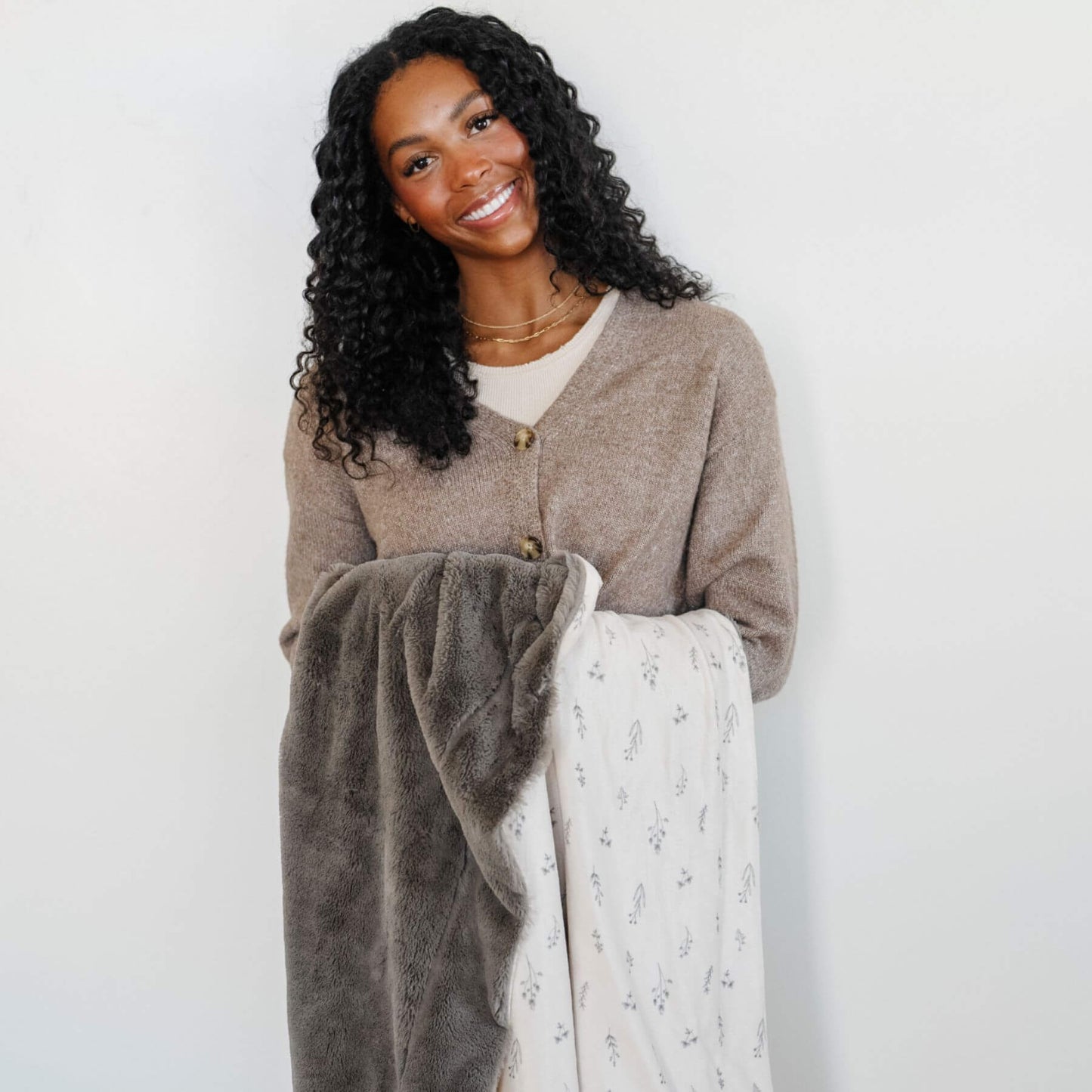 Woman holding Saranoni Minky/Lush Throw Blankets - Jasmine