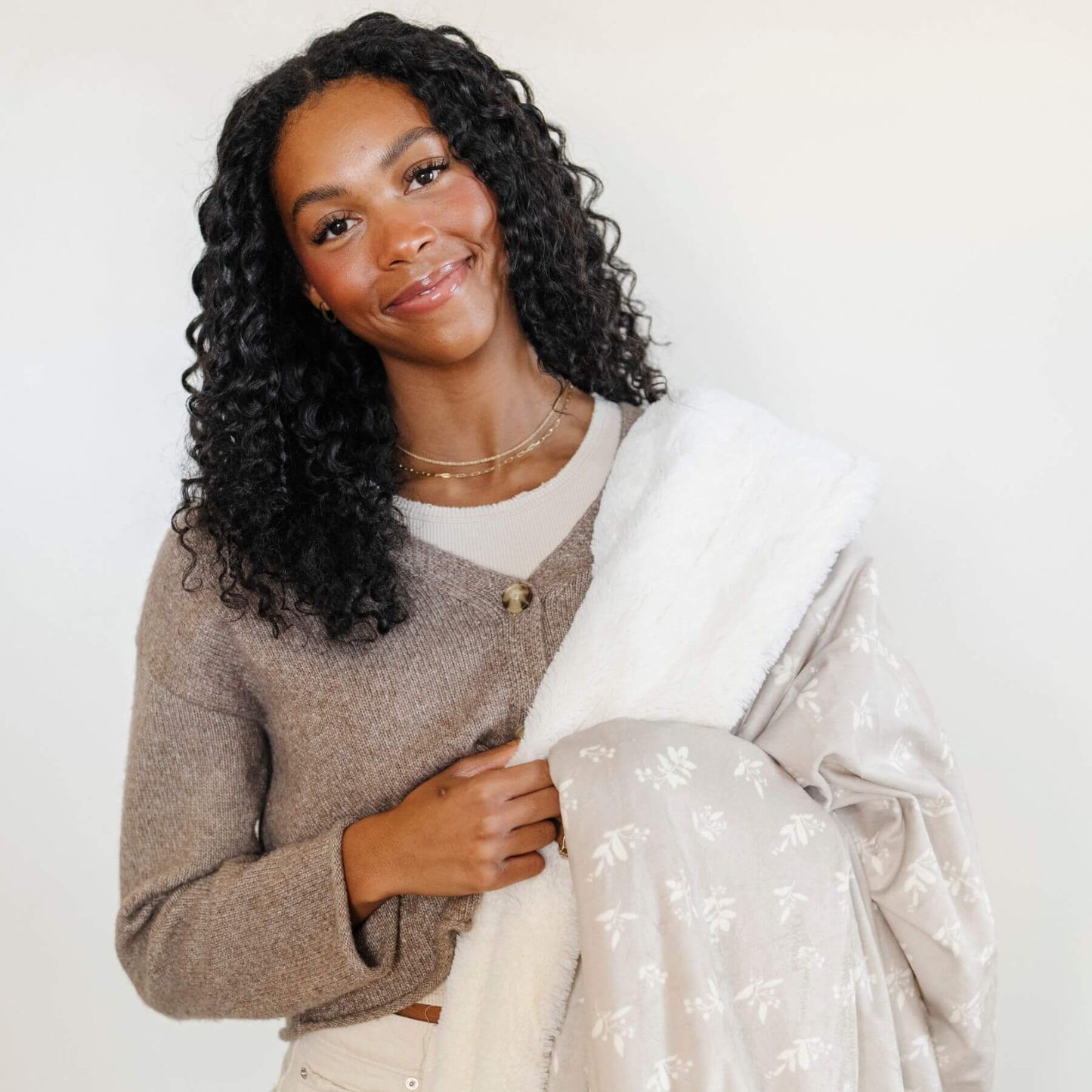 Woman holding Saranoni Minky/Lush Throw Blankets - Lily
