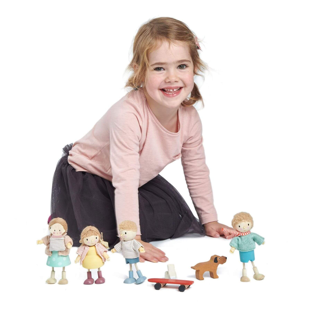 Child playing with toy figures on a white background