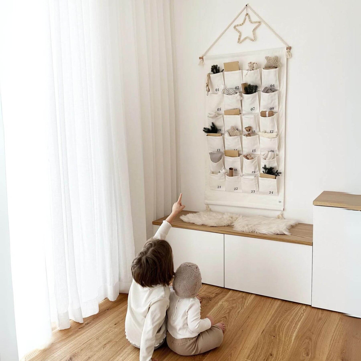 Kids Sitting in front of Unique Love Design Advent Calendar 'Magic Moments'