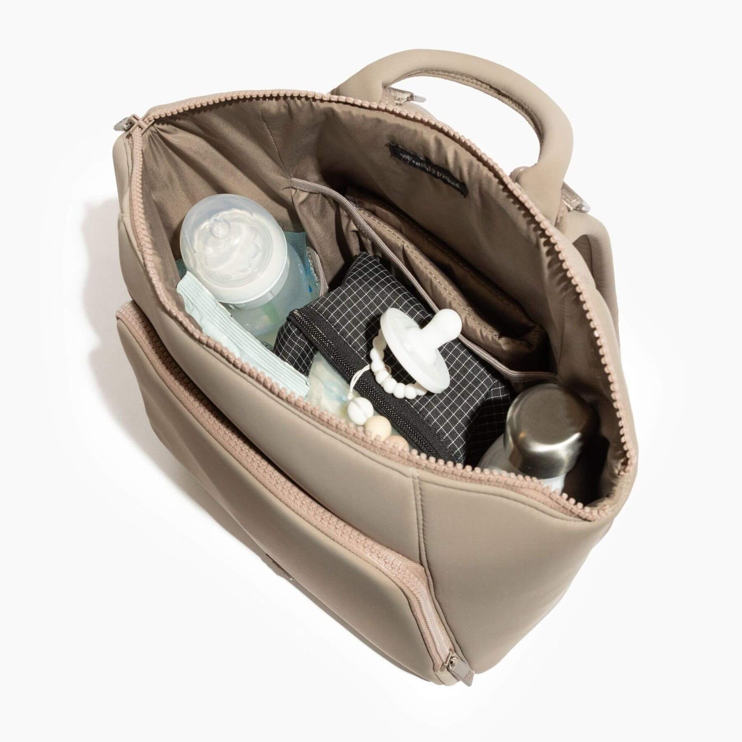 Freshly Picked Aspen Seoul Neoprene Backpack II with baby items including a bottle, pacifier, and bottle opener