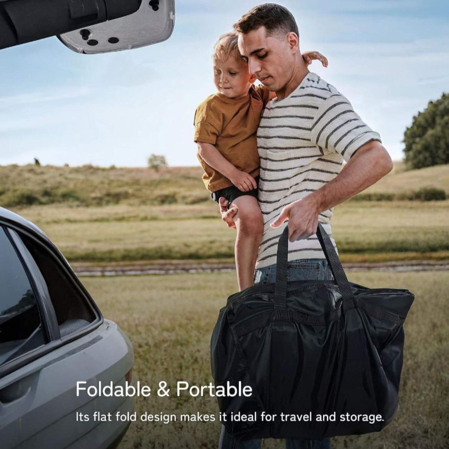 Man holding a child and a black duffel bag with text about the bag's portability.