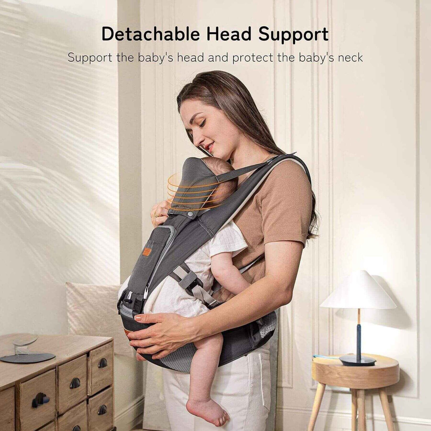 Woman holding a baby in Besrey Carrier with Front Facing Holder in a home setting.