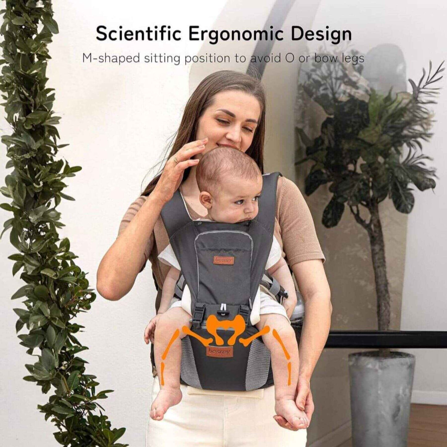 Woman holding a baby in Besrey Carrier with Front Facing Holder with scientific ergonomic design text overlay.