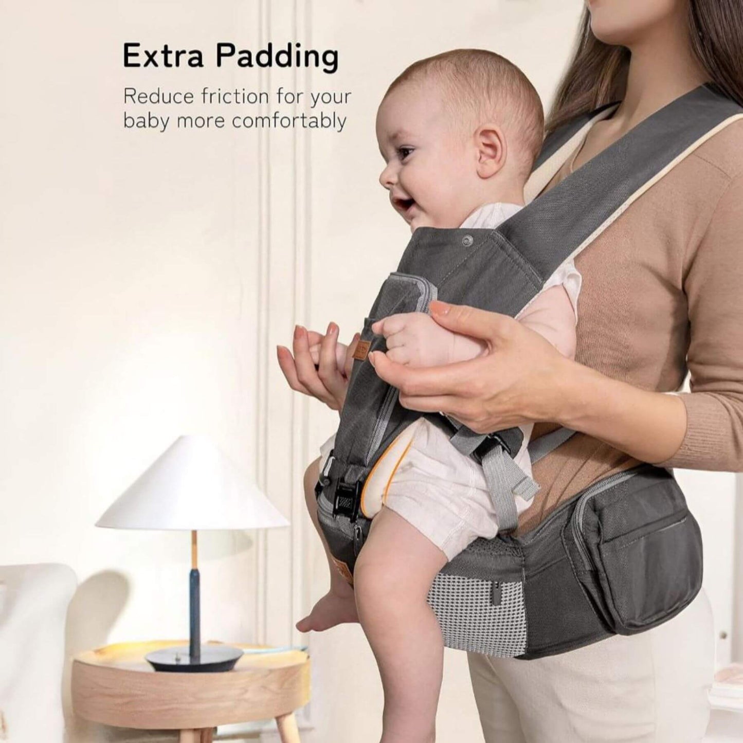 Baby being carried in Besrey Carrier with Front Facing Holder with text about extra padding.
