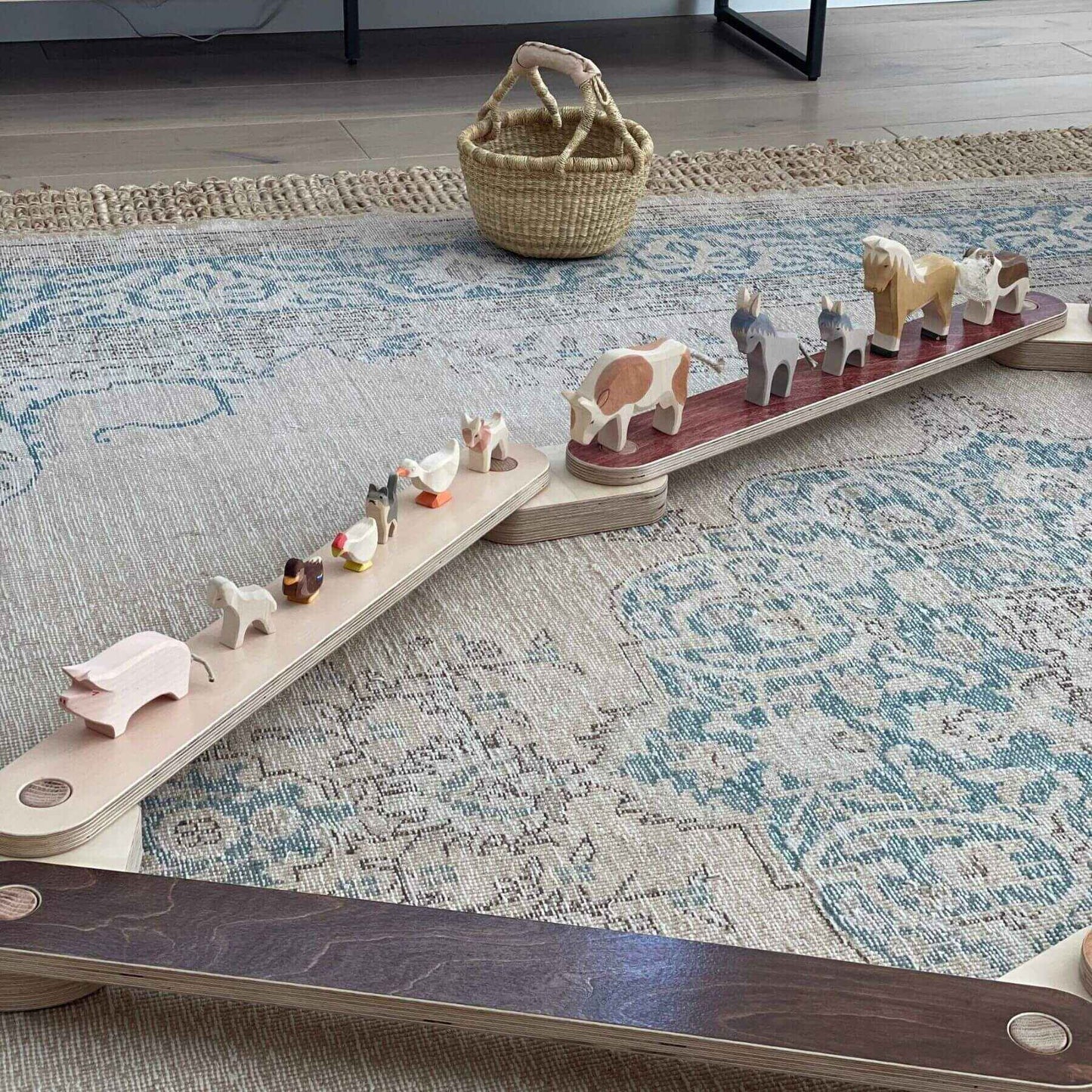 Bunny Hopkins Balance Beam with animal figures on a patterned rug
