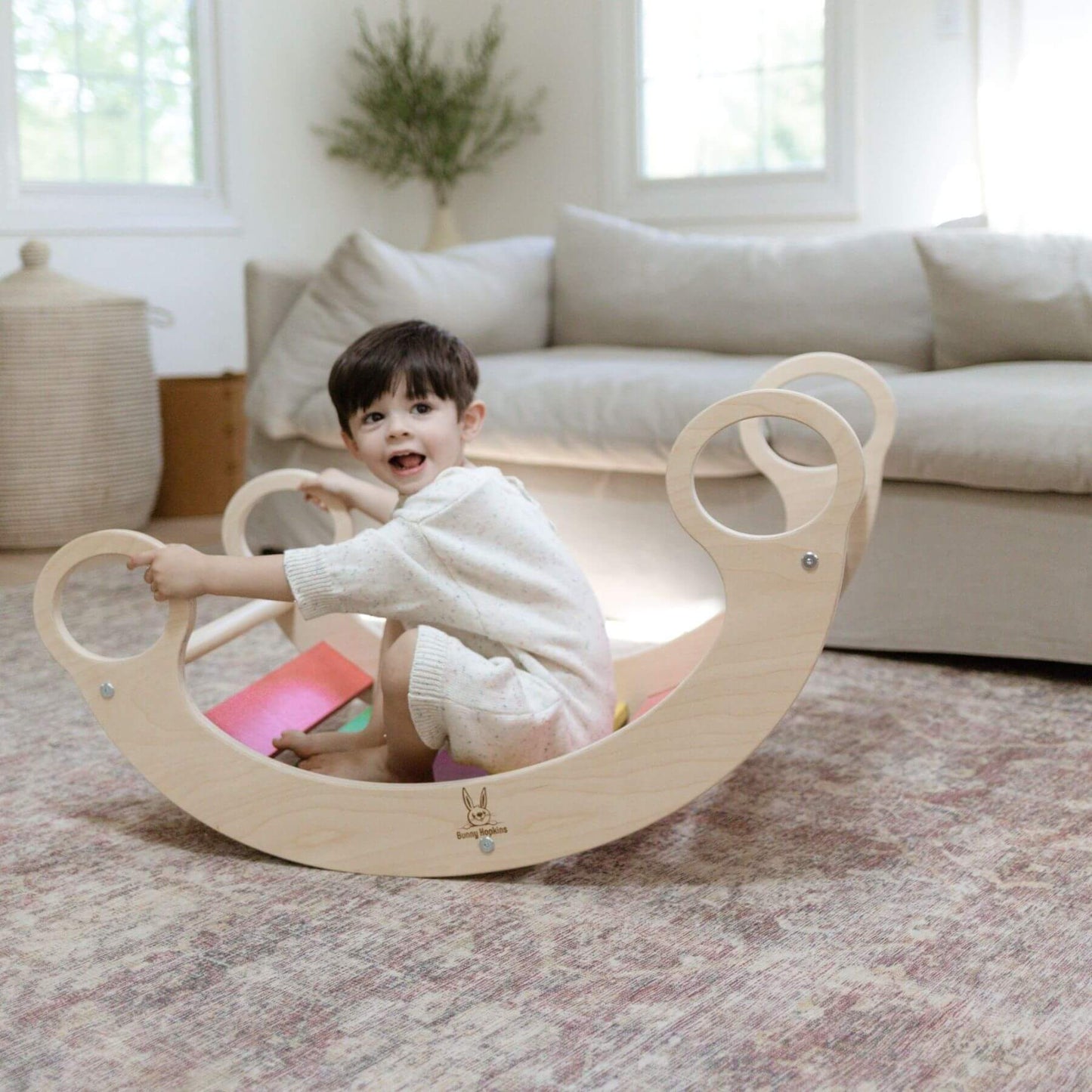 Boy Rocking on Bunny Hopkins Climbing Arch Blush