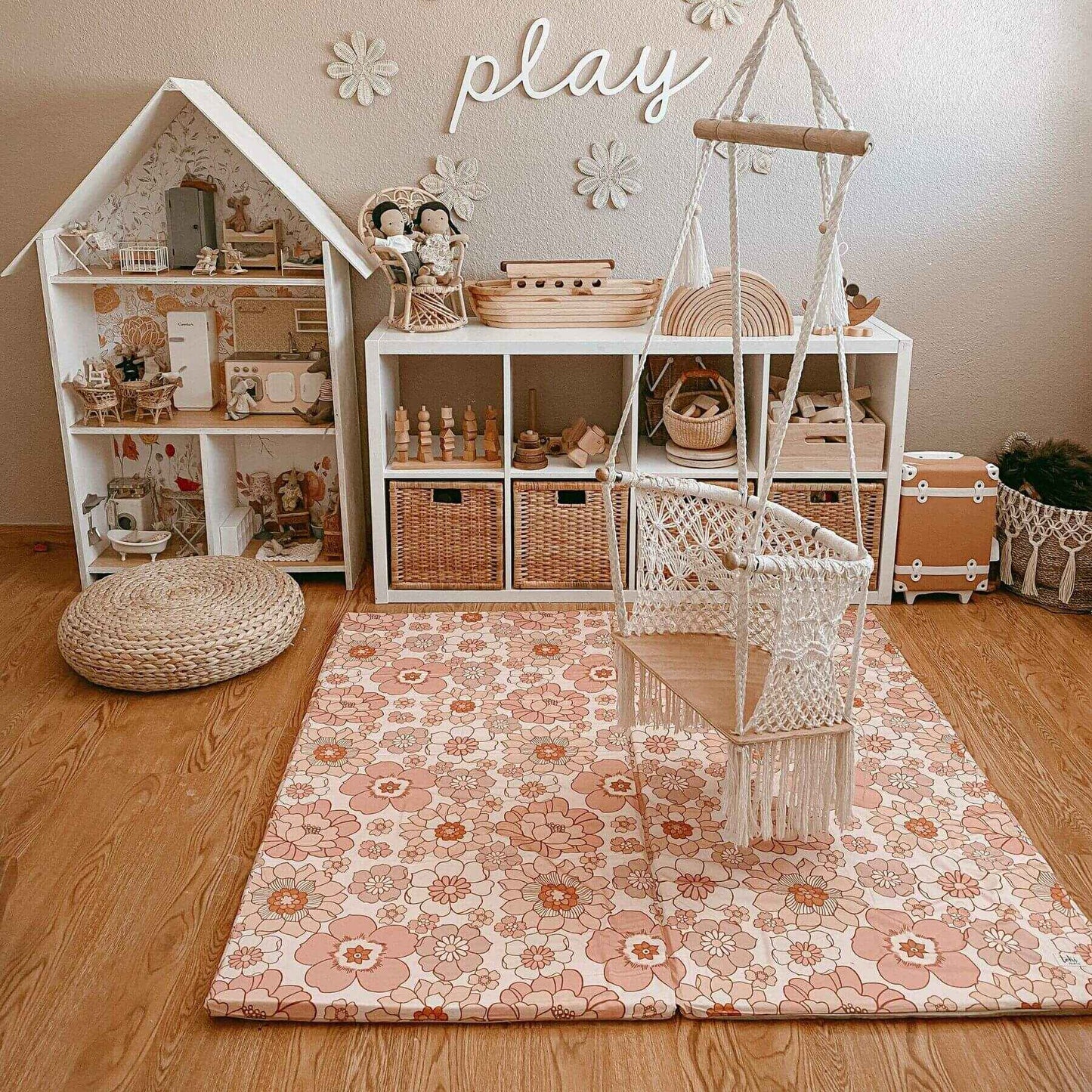 Children's playroom with dollhouse, toys, and Toki Mats Blooms Organic Cotton Mat.