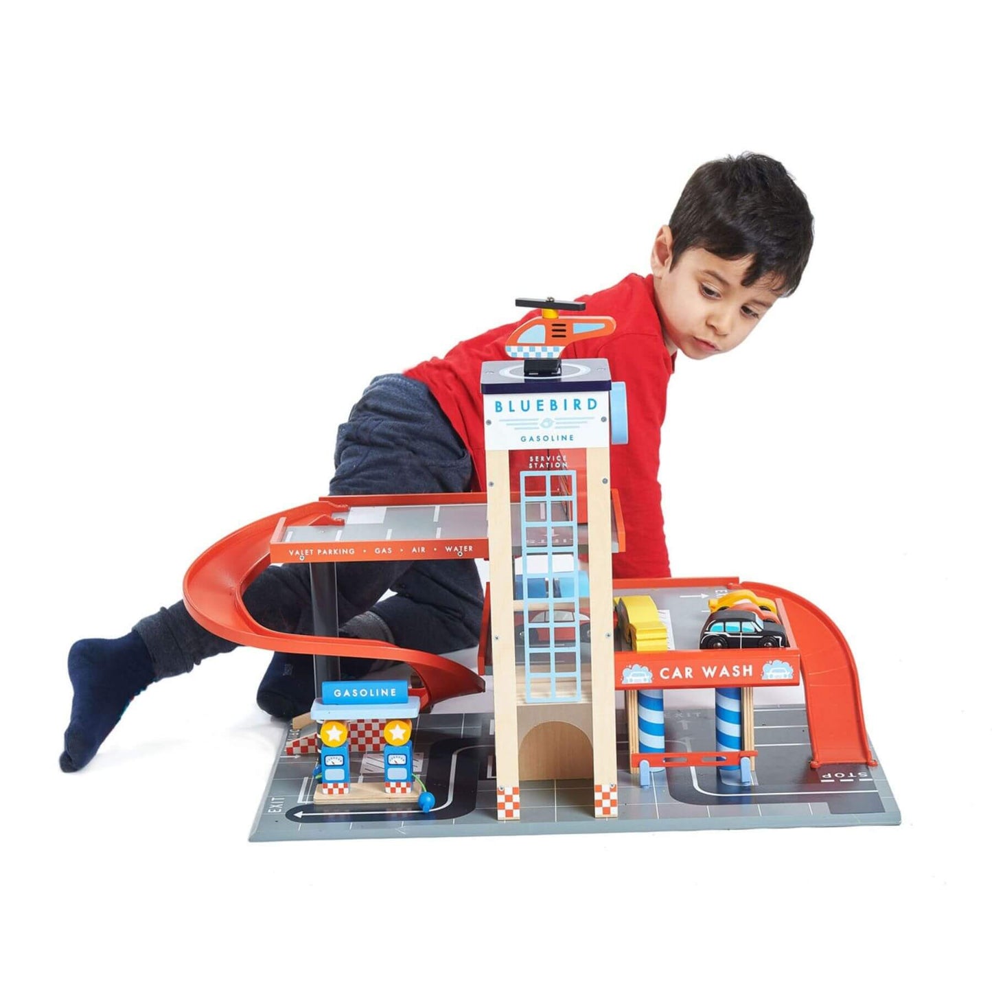 Child playing with Tender Leaf Blue Bird Service Station on a white background