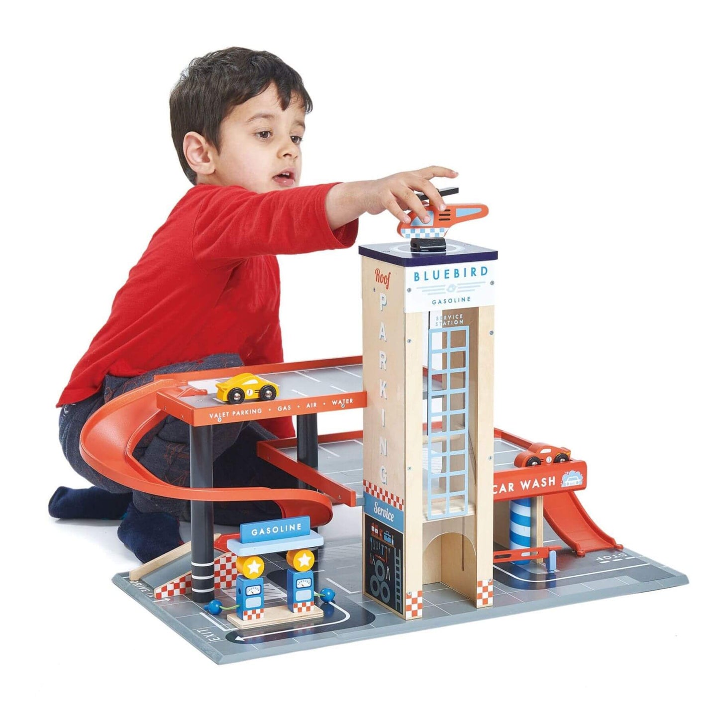 Child playing with Tender Leaf Blue Bird Service Station on a white background