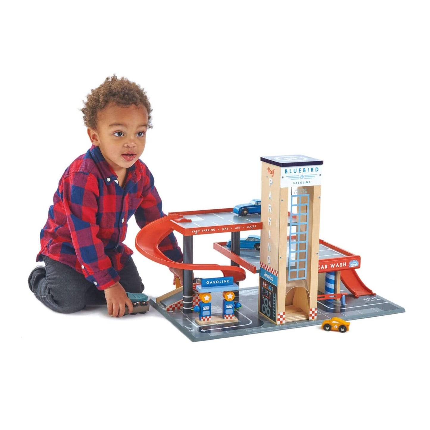Child playing with Tender Leaf Blue Bird Service Station on a white background