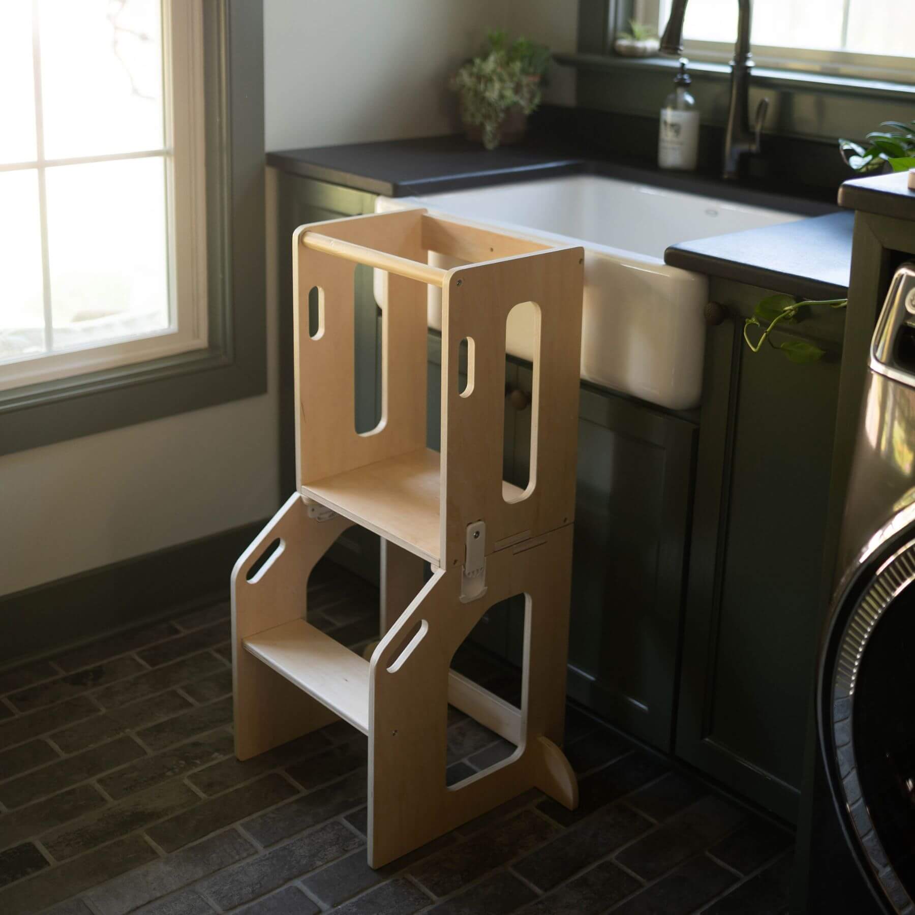 Busy Kids 2-In-1 Kitchen Tower and Kids Art Desk next to Sink
