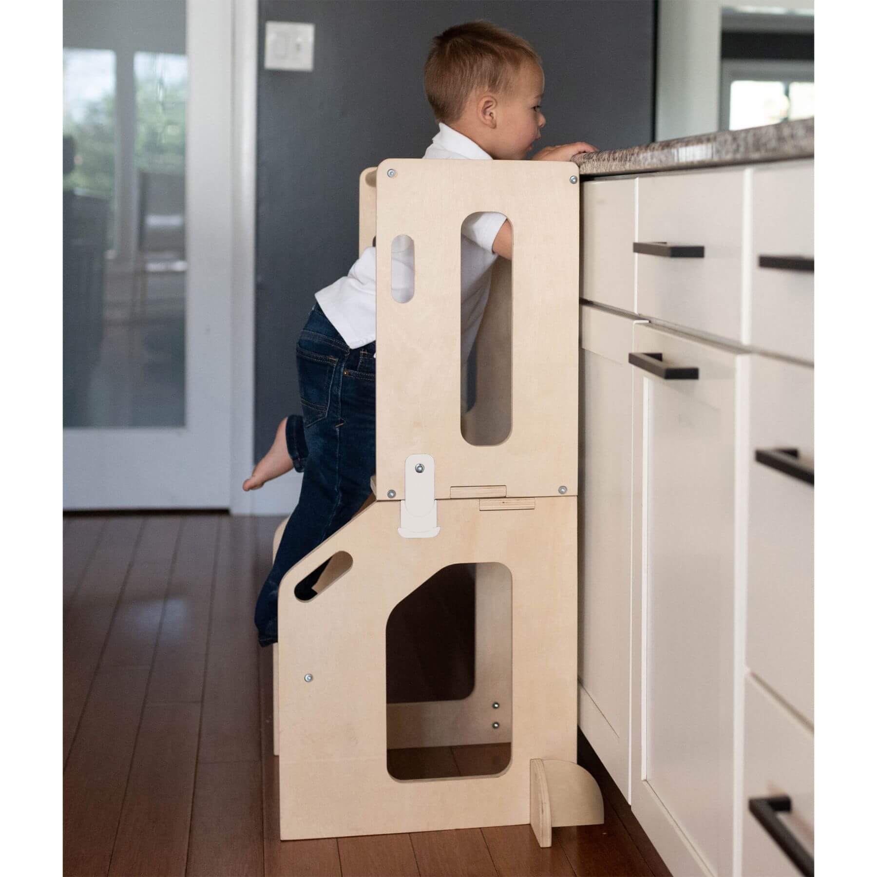 Boy Standing on Busy Kids 2-In-1 Kitchen Tower and Kids Art Desk
