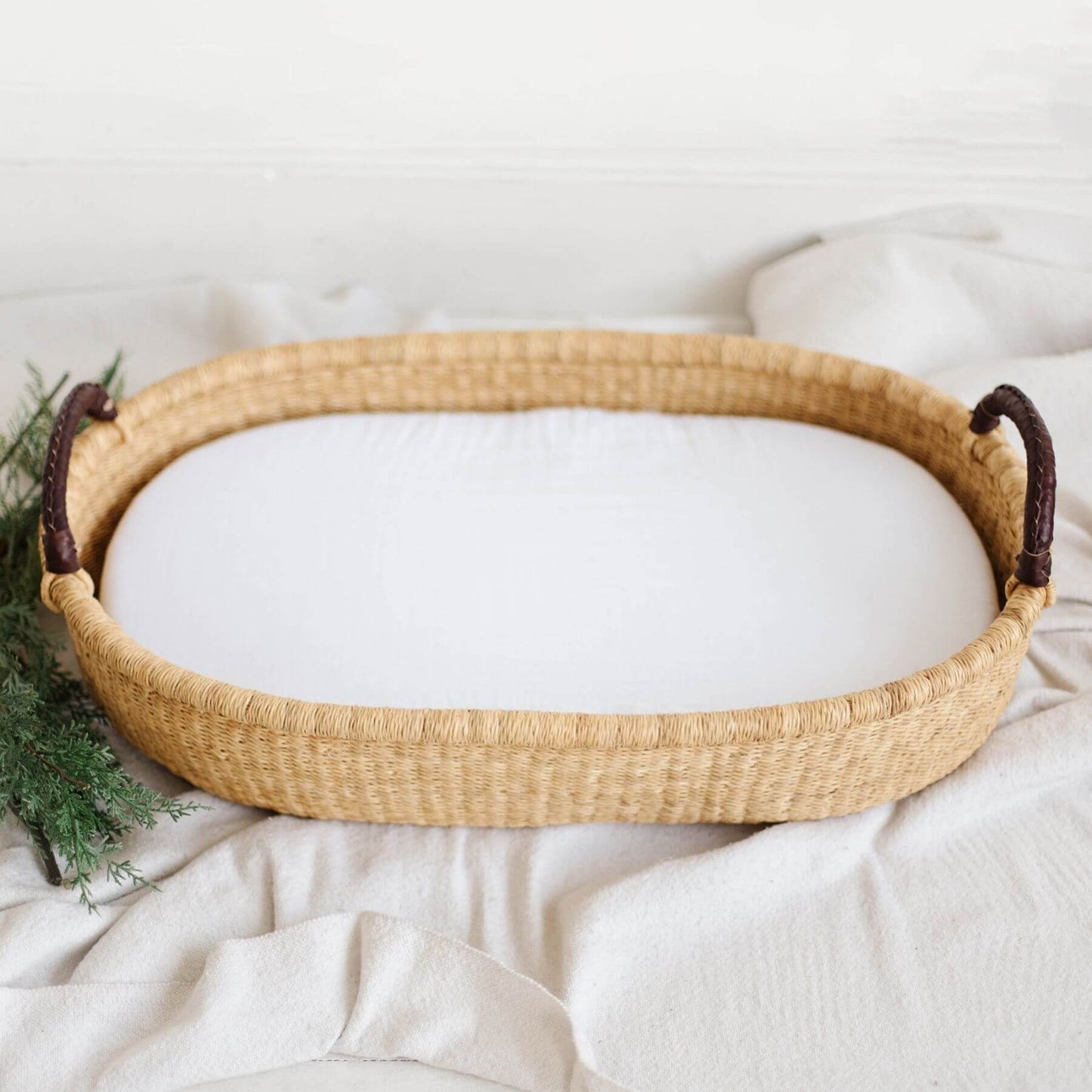 Plum+Sparrow Changing Basket Brown Handle on a light background