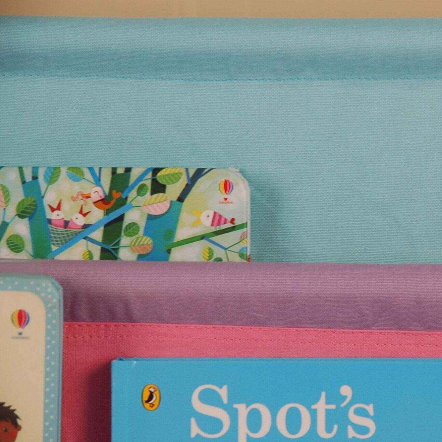 Close-up of Charlie White Kids Wooden Canvas Sling Magazine Bookcase