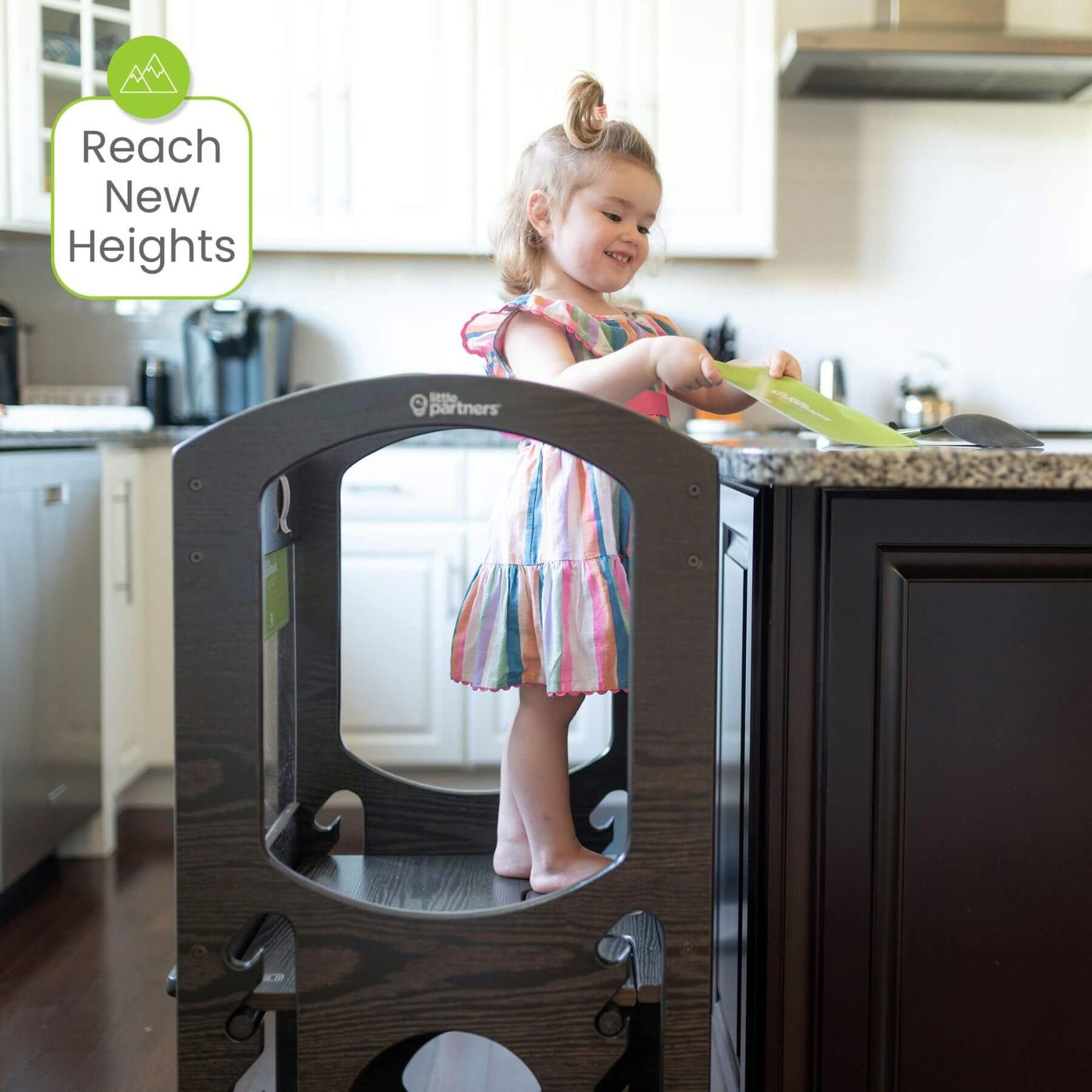 Girl Standing on Little Partners Chef Series Learning Tower Charcoal