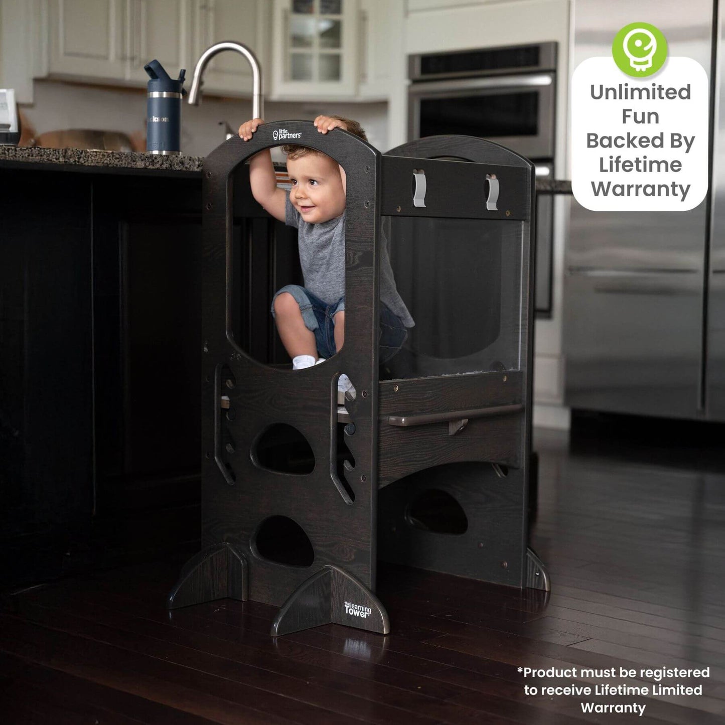Boy Climbing on Little Partners Chef Series Learning Tower Charcoal