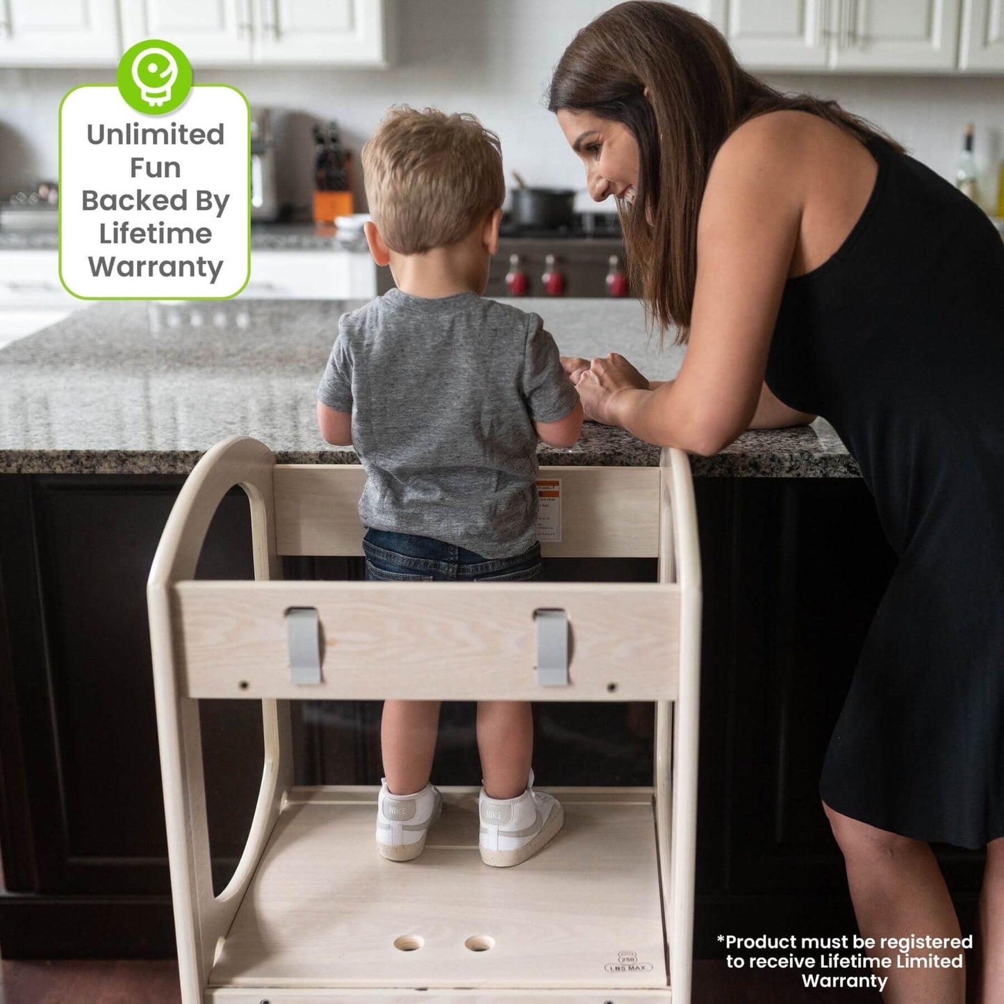 Boy Standing on Little Partners Chef Series Learning Tower Natural, with Mom