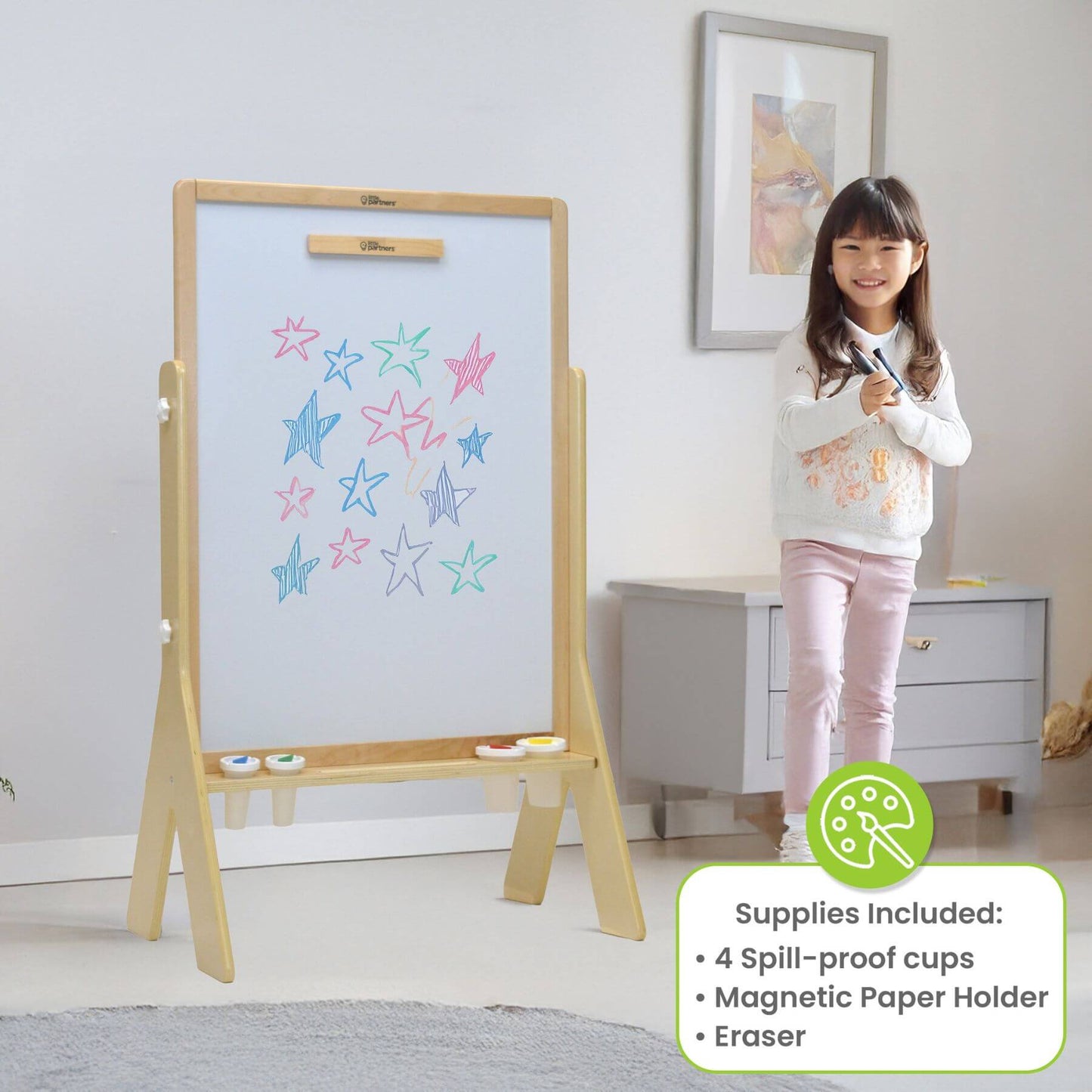 Girl Standing next to Little Partners Contempo Art Easel Natural