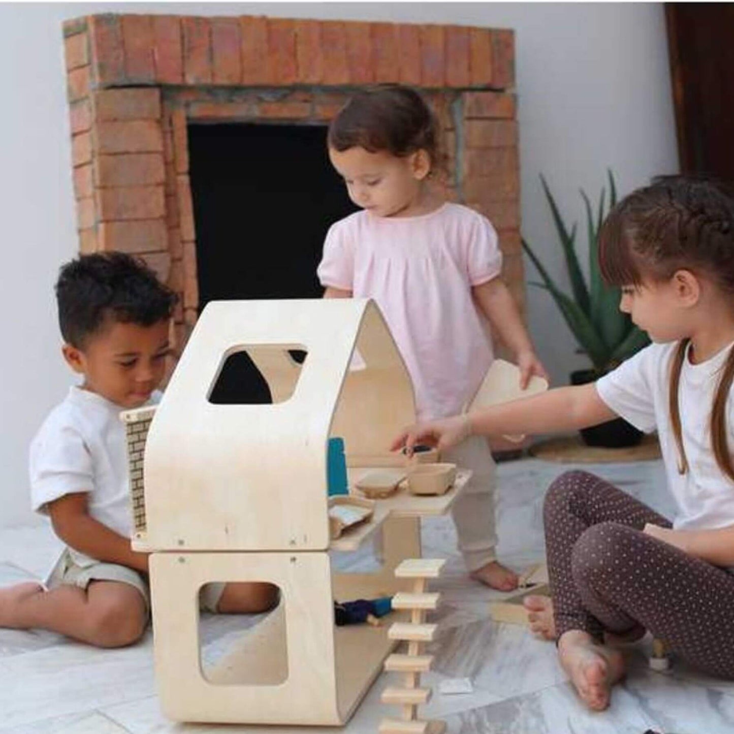 Kids Playing PlanToys Contemporary Dollhouse