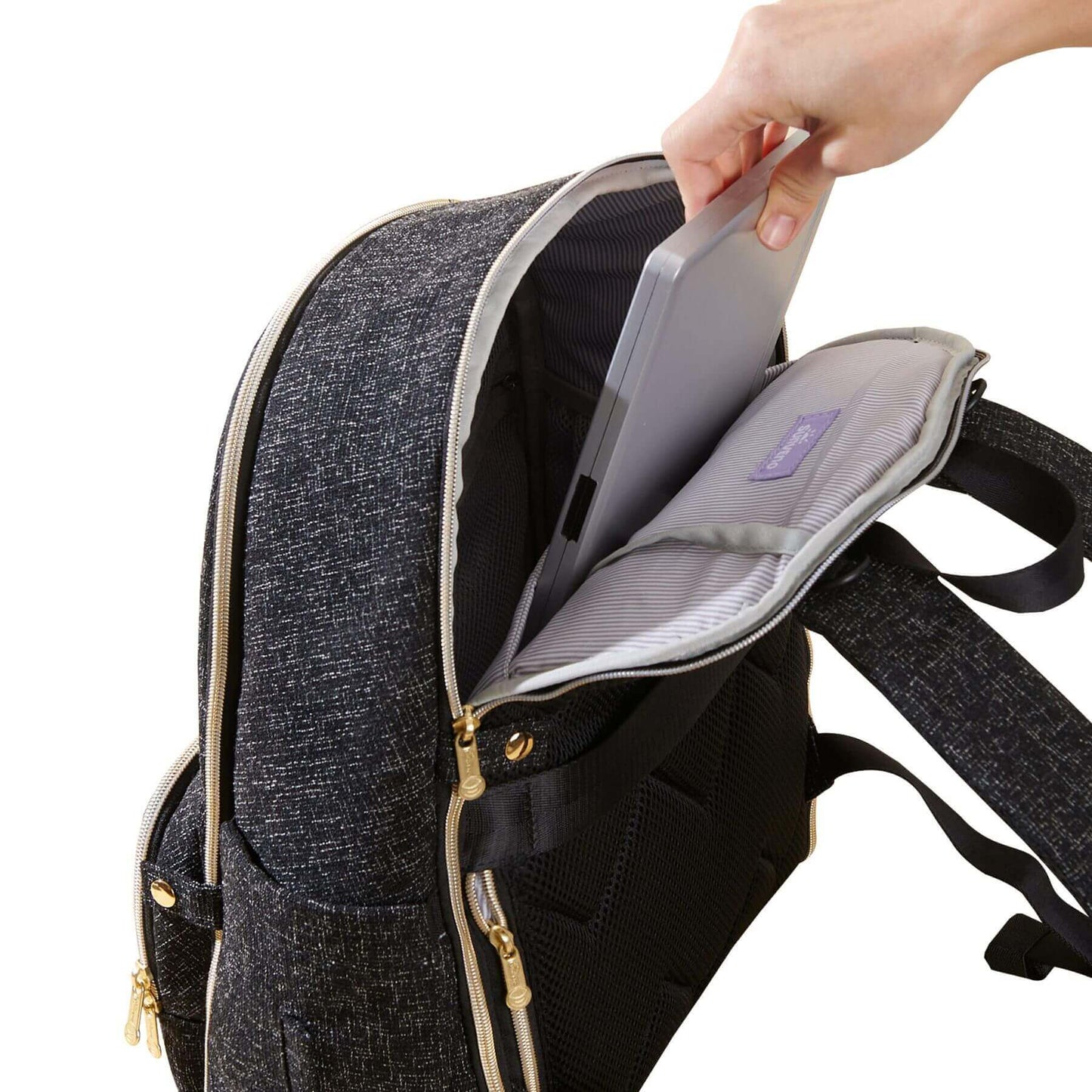 Person placing a tablet into Sunveno Convertible Tweed Diaper Backpack Black