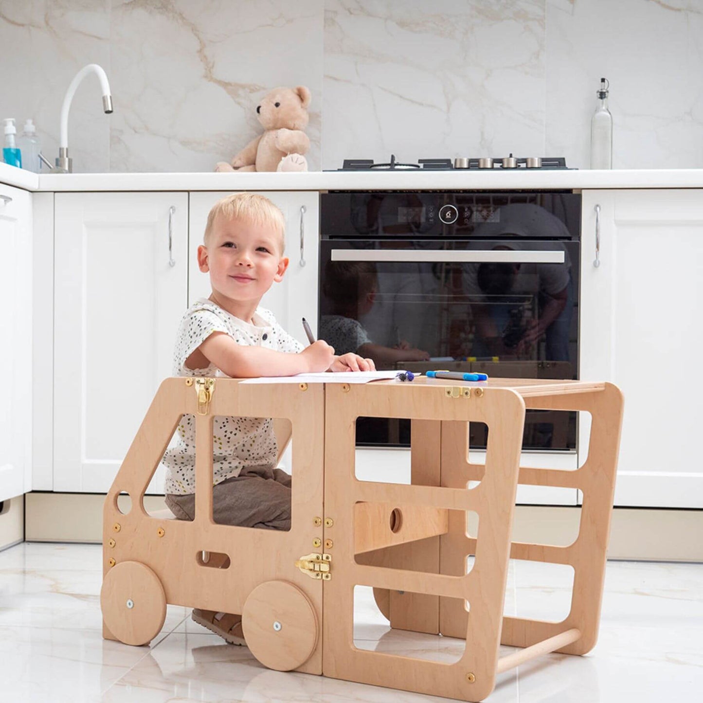 Boy Sitting at Wood and Hearts Convertible Kitchen Tower Truck Wood