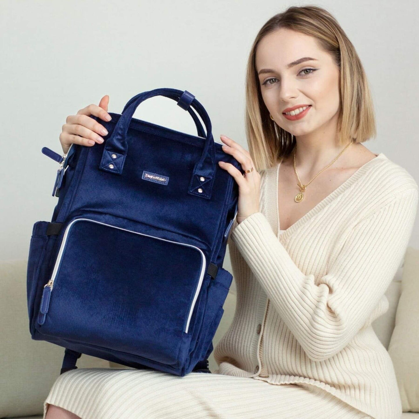 Woman holding Corduroy Diaper Backpack Blue