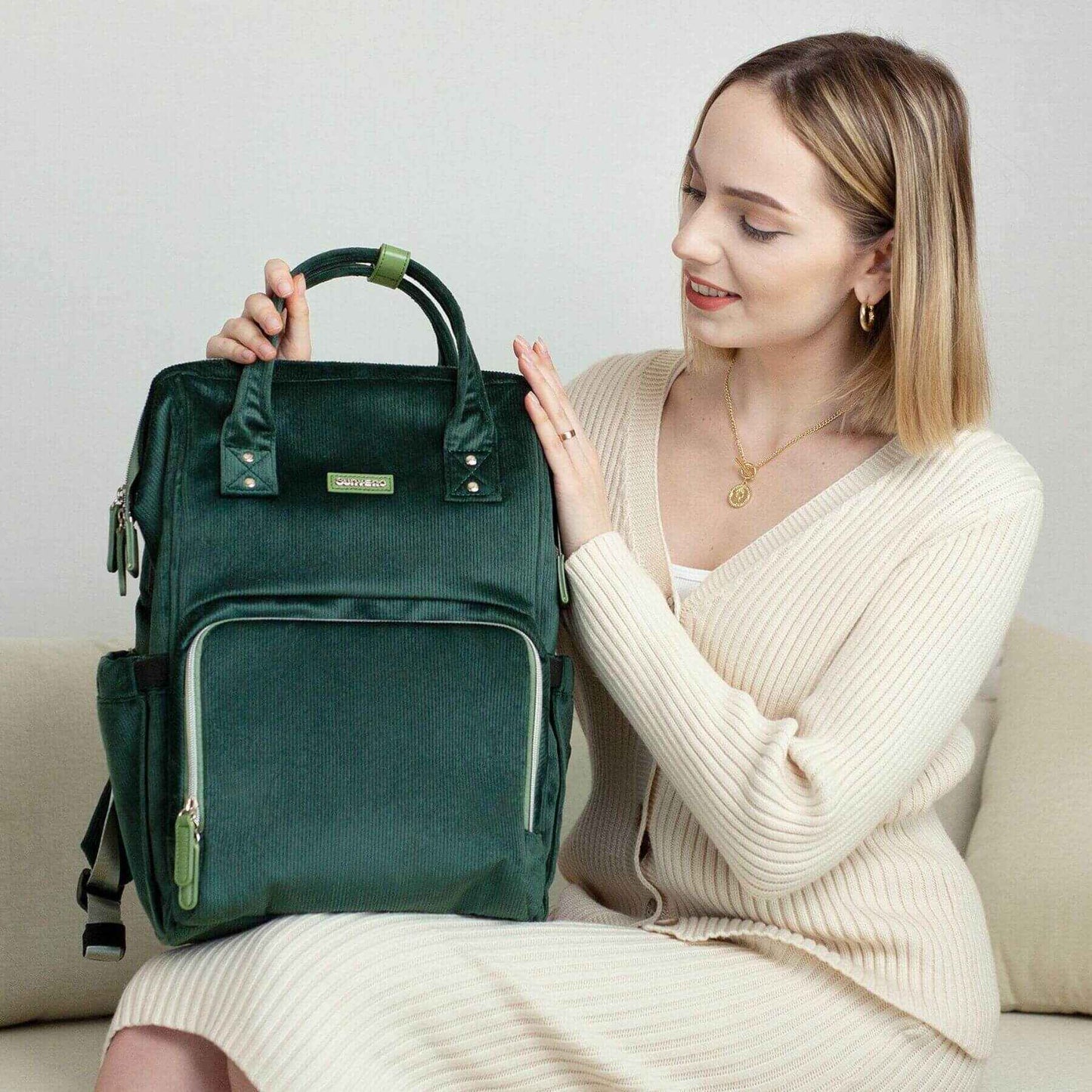 Woman holding Corduroy Diaper Backpack Green
