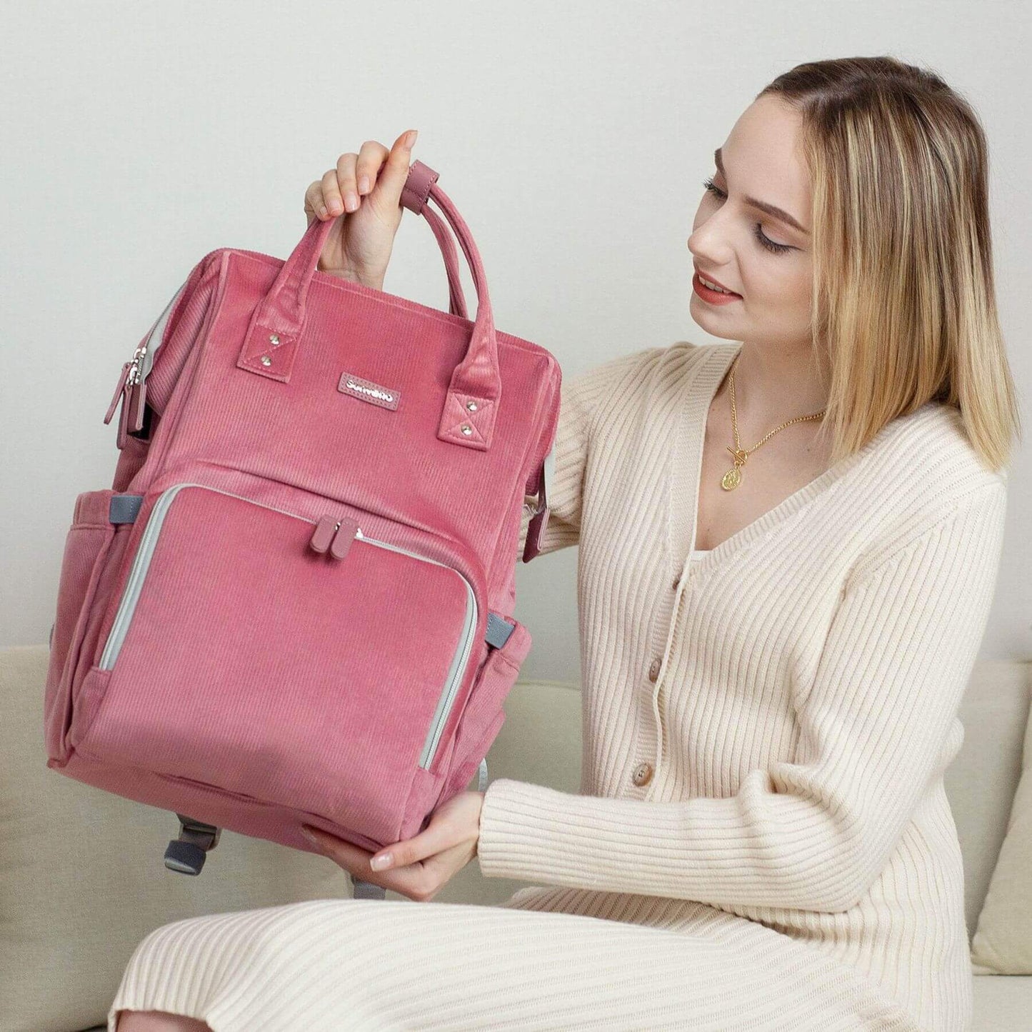 Woman holding Corduroy Diaper Backpack Pink