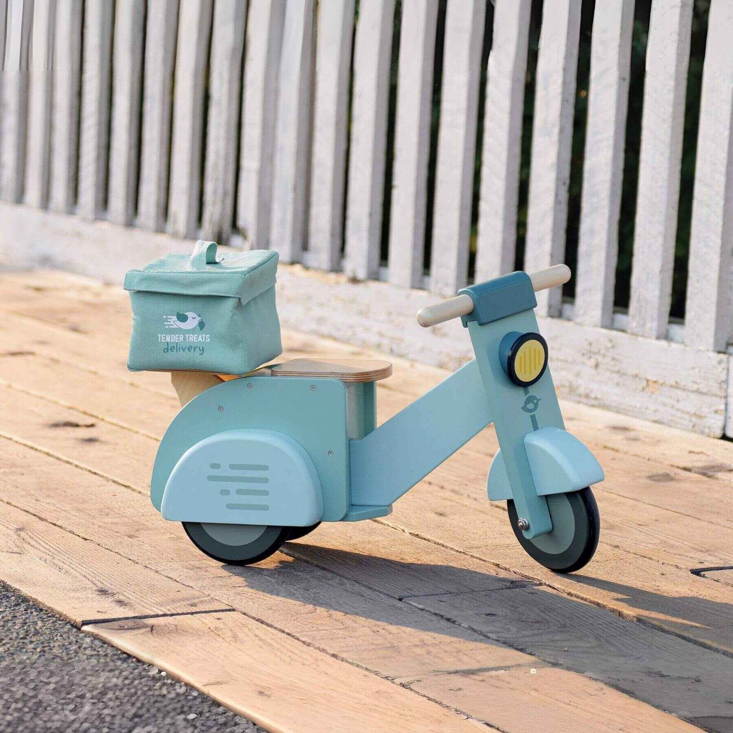 Tender Leaf Delivery Scooter on a wooden surface.