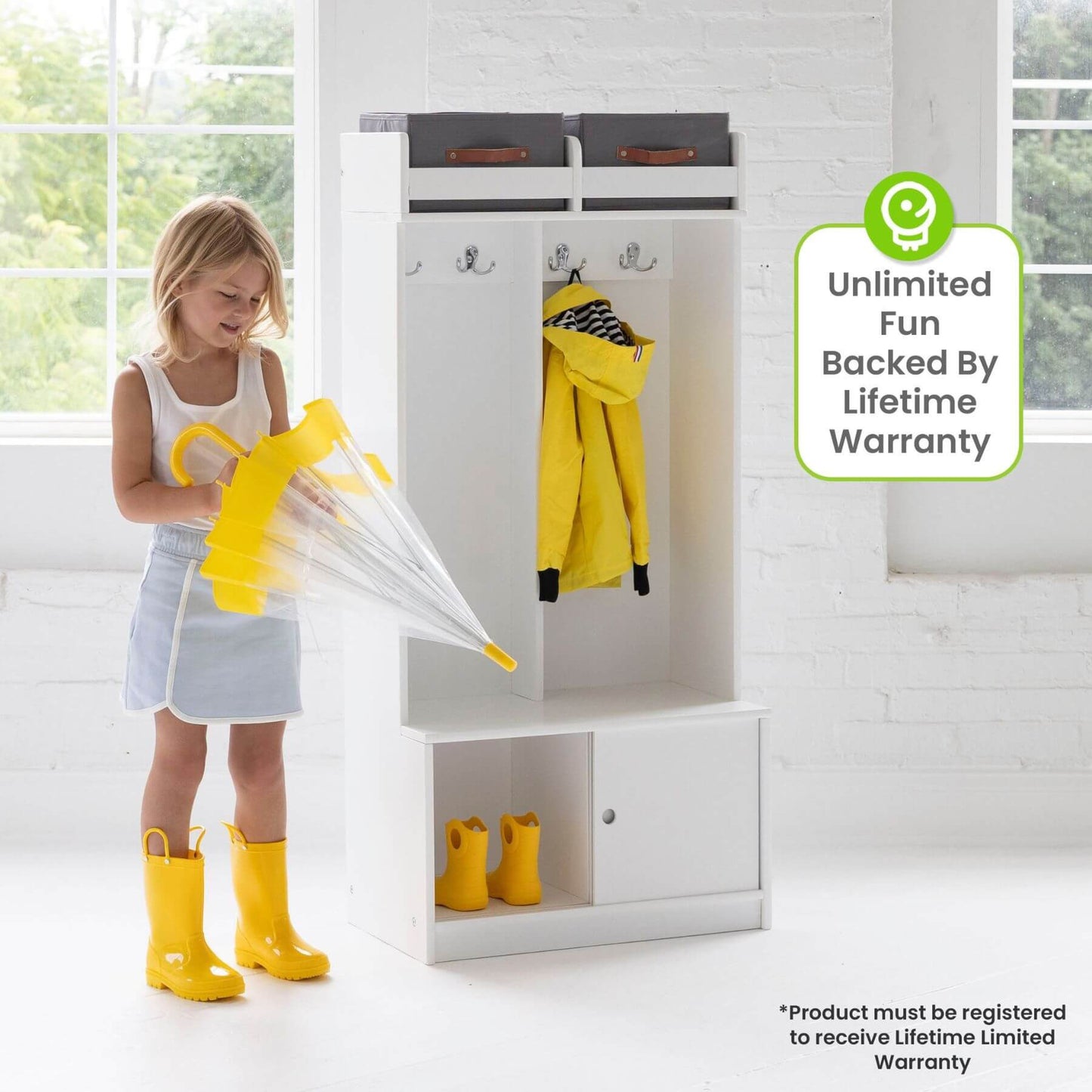 Girl Folding Umbrella next to Little Partners Deluxe Cubby White