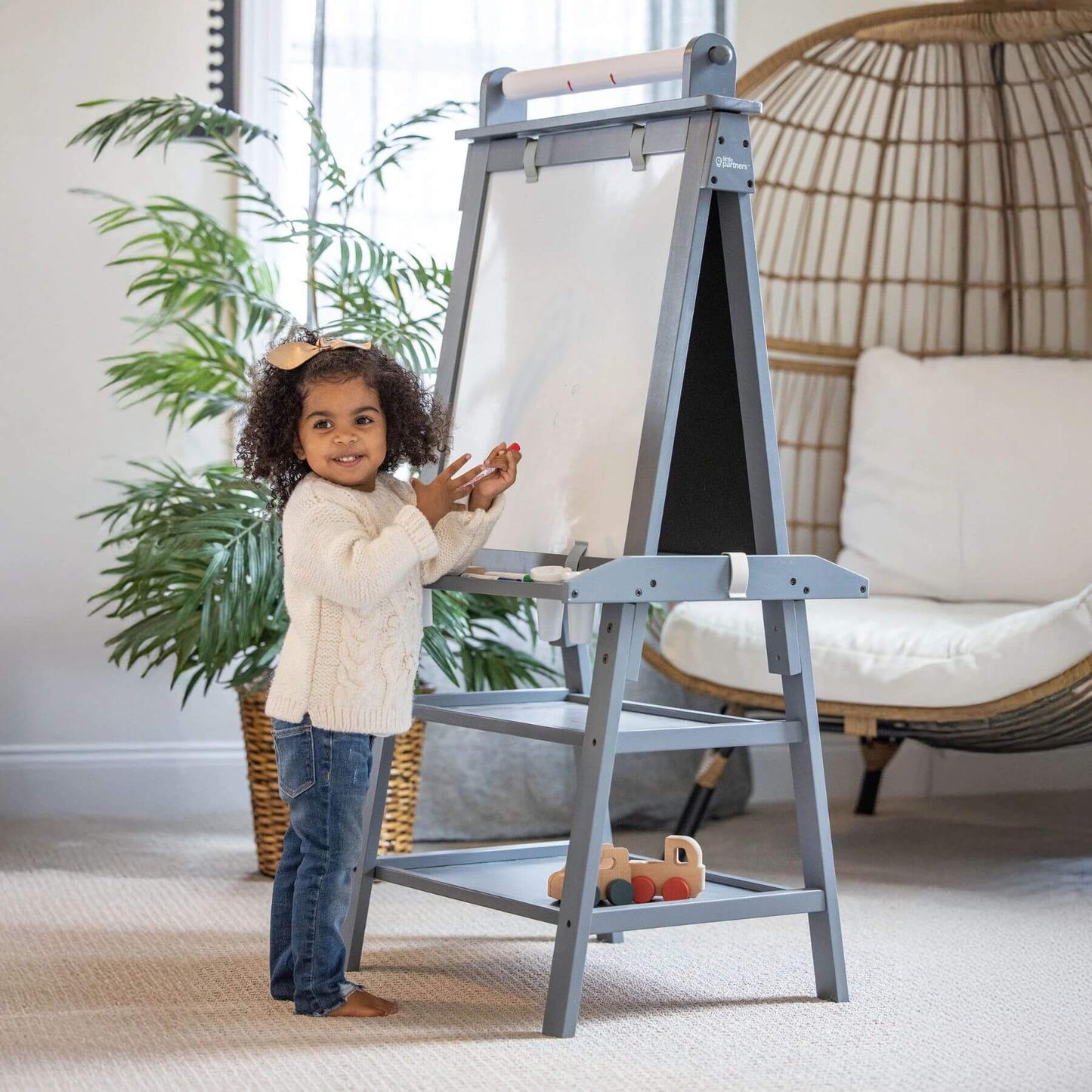 Girl Drawing on Little Partners Deluxe Learn & Play Art Center Grey
