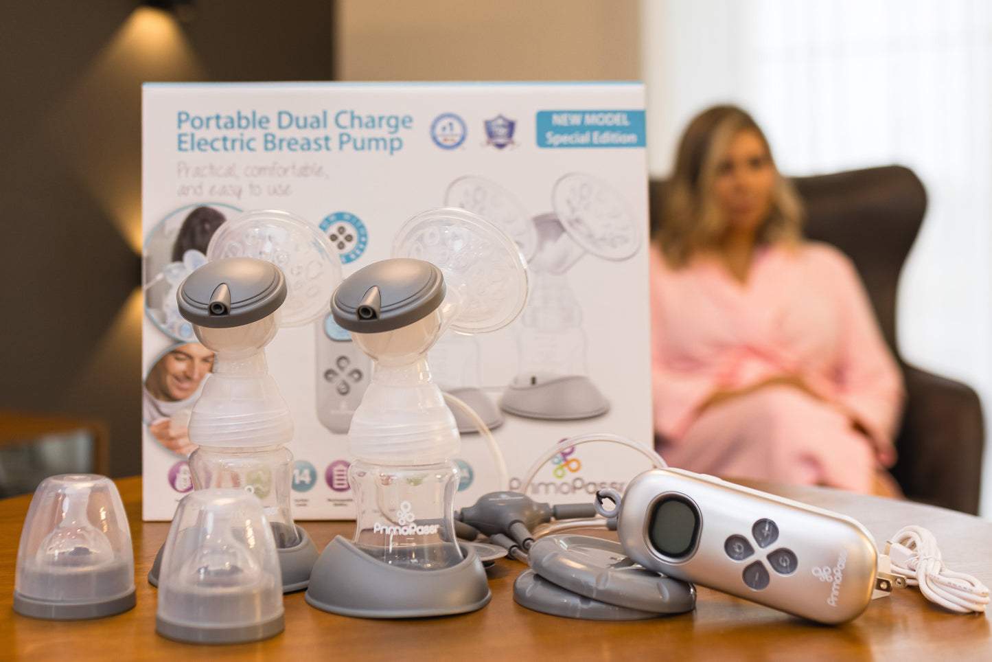 Primo Passi Portable Double Electric Breast Pump with packaging and components on a table.