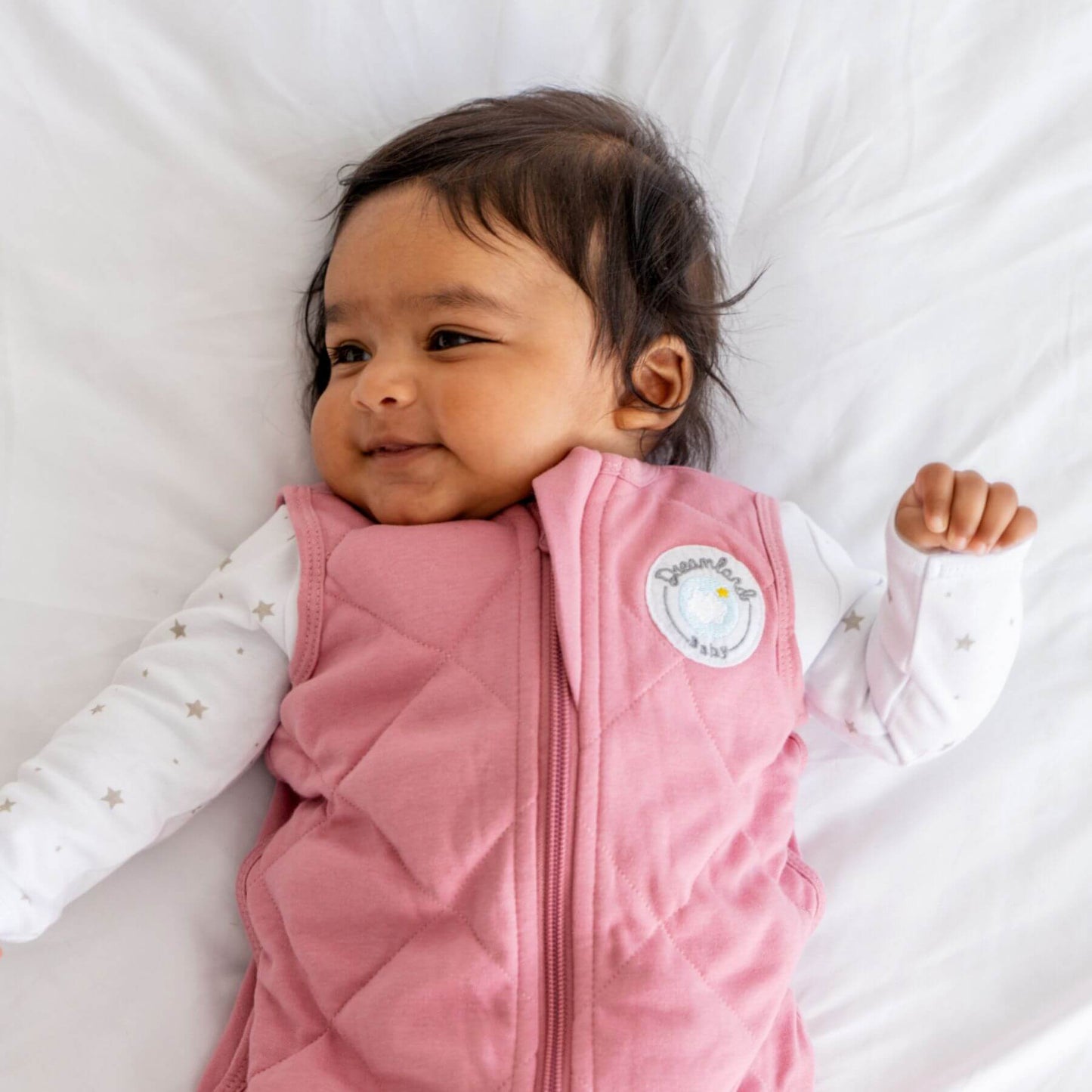 Baby wearing Dreamland Baby Dream Weighted Sleep Sack Dusty Rose
