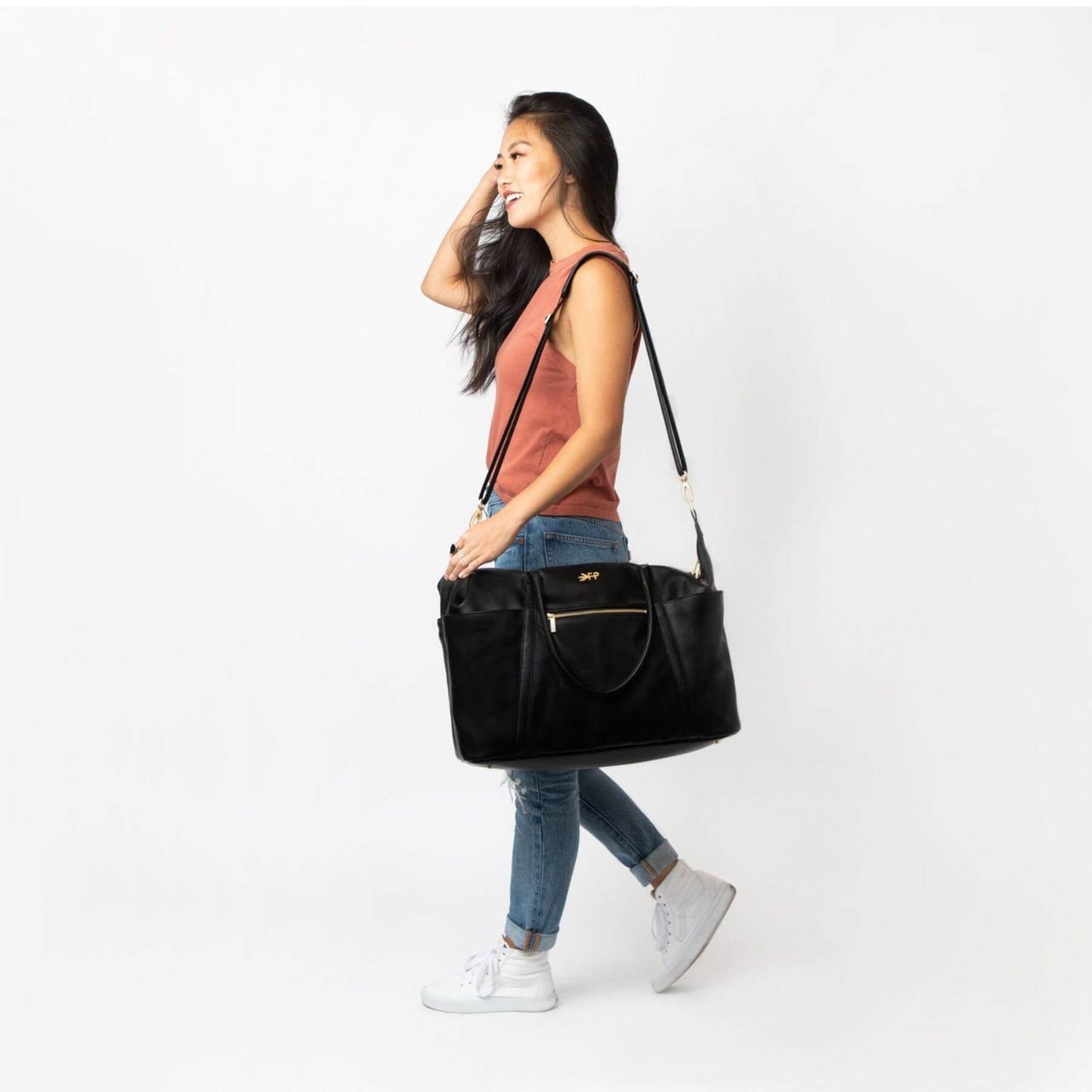 Woman carrying Ebony Classic Weekender
