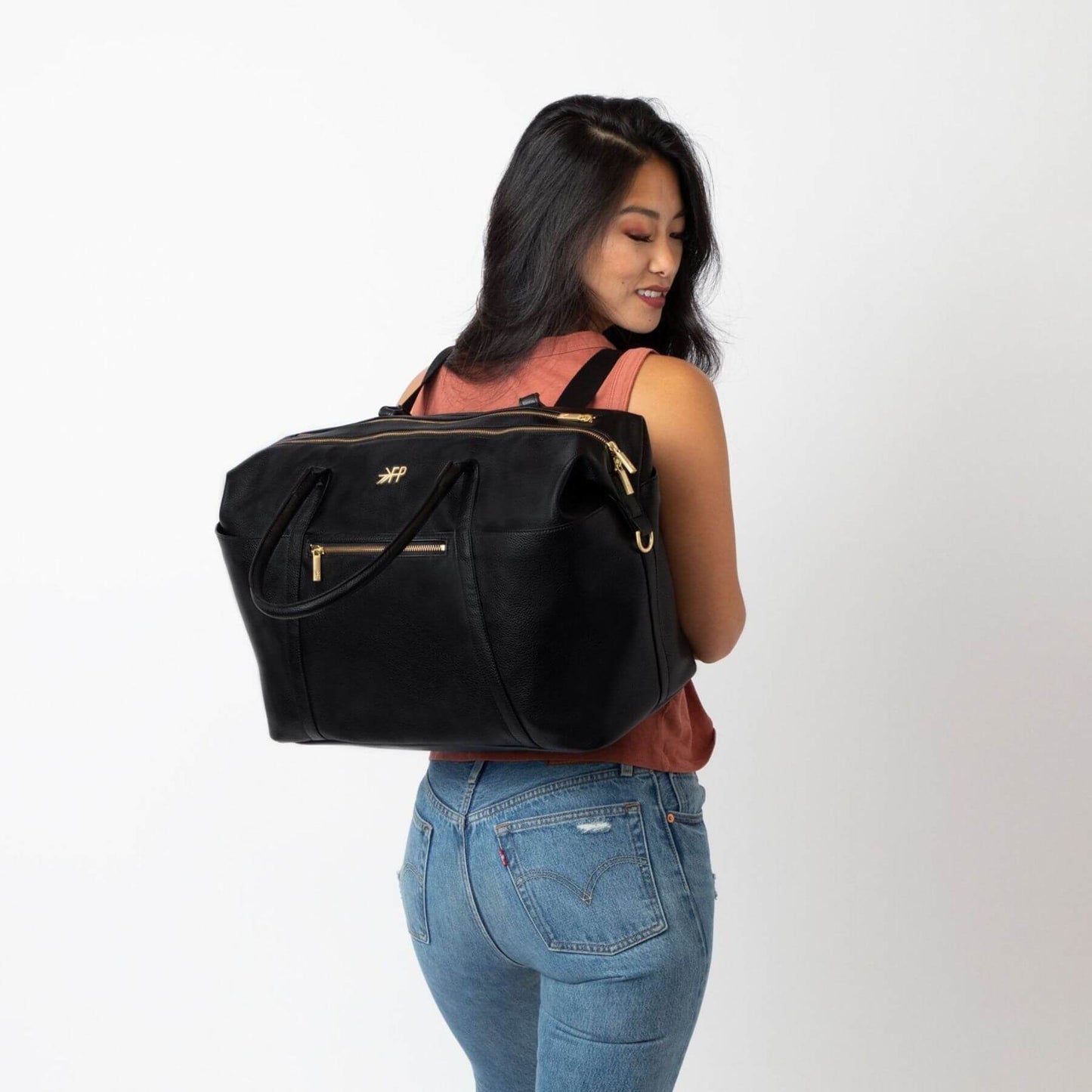 Woman carrying Ebony Classic Weekender