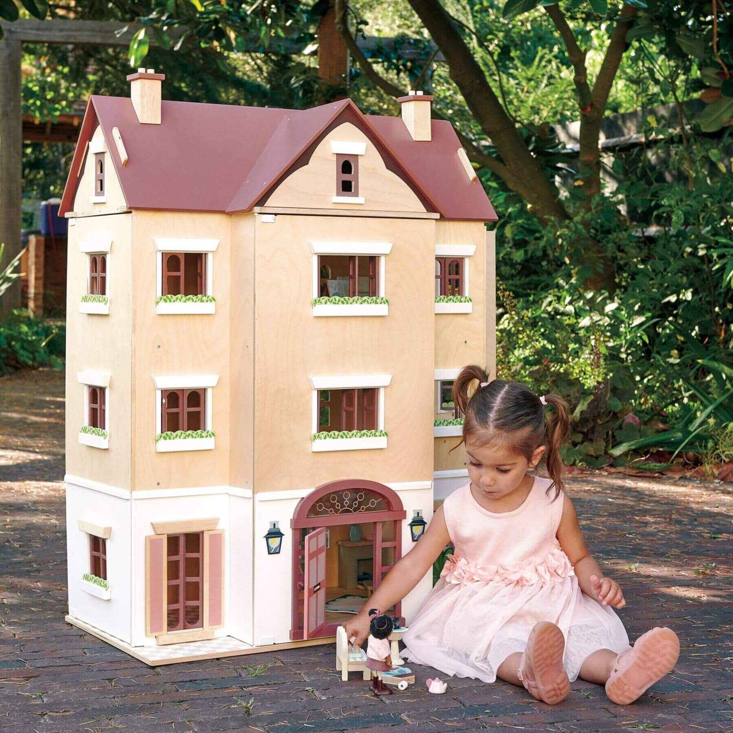 Child playing with Tender Leaf Fantail Hall outdoors