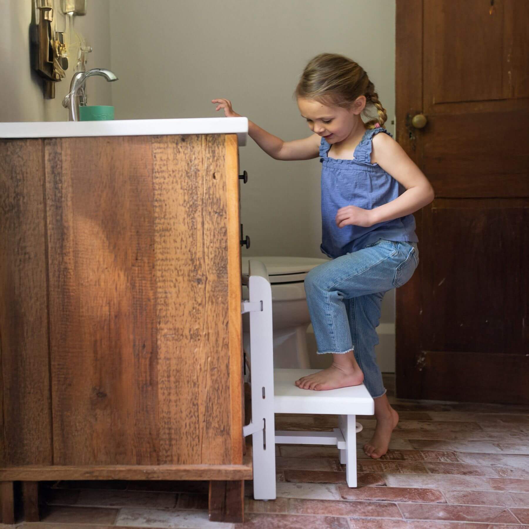 Girl Stepping on Busy Kids Fold 'N Store Step Stool White