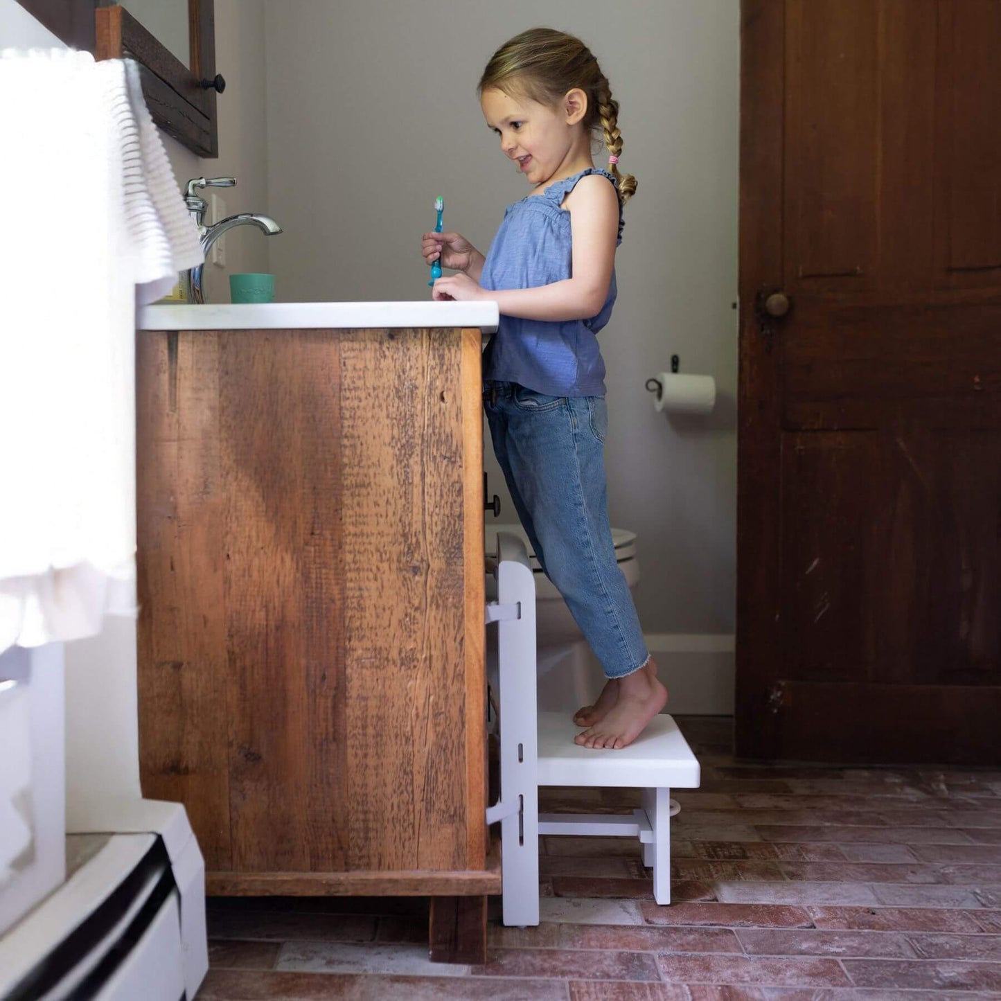 Girl Stepping on Busy Kids Fold 'N Store Step Stool White