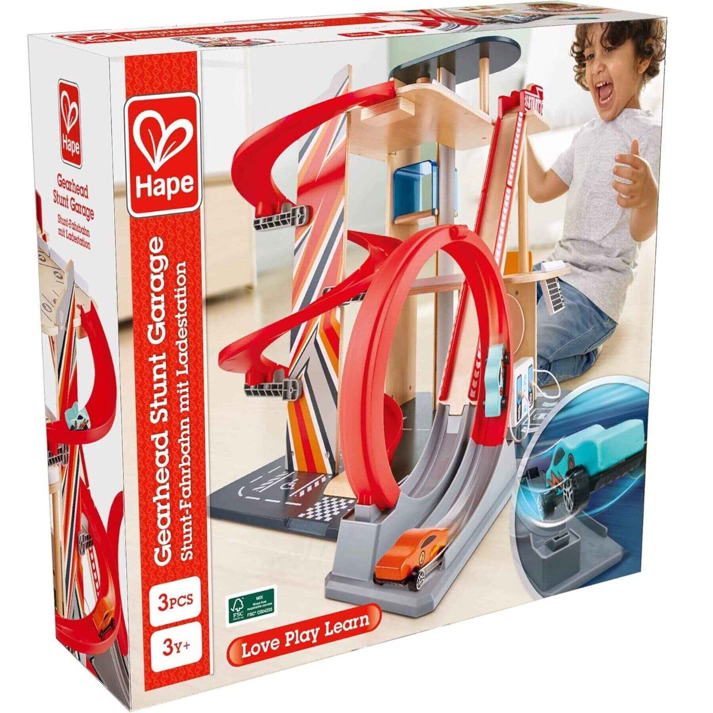 Hape toy garage set packaging with a child playing and toy cars on a white background