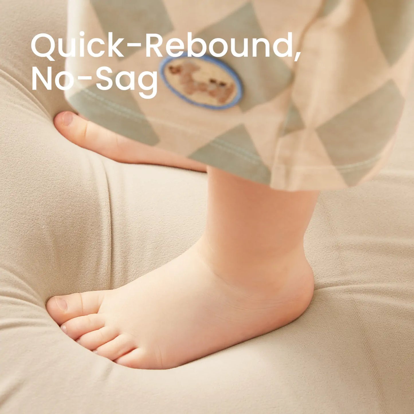 Baby's foot on Tiny Land® GentleSnug Kid Chair Beige White with text 'Quick-Rebound, No-Sag' in the background.