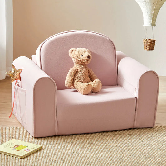 Tiny Land® GentleSnug Kid Chair Pink on a carpeted floor.