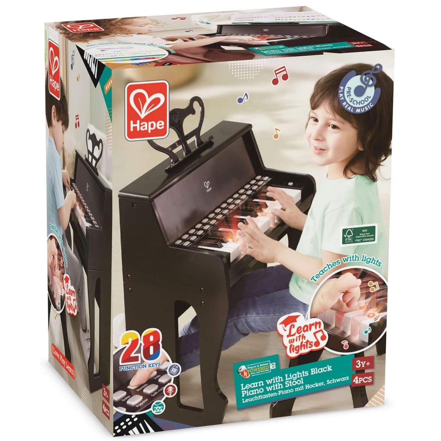 Hape toy piano packaging with child playing on a white background