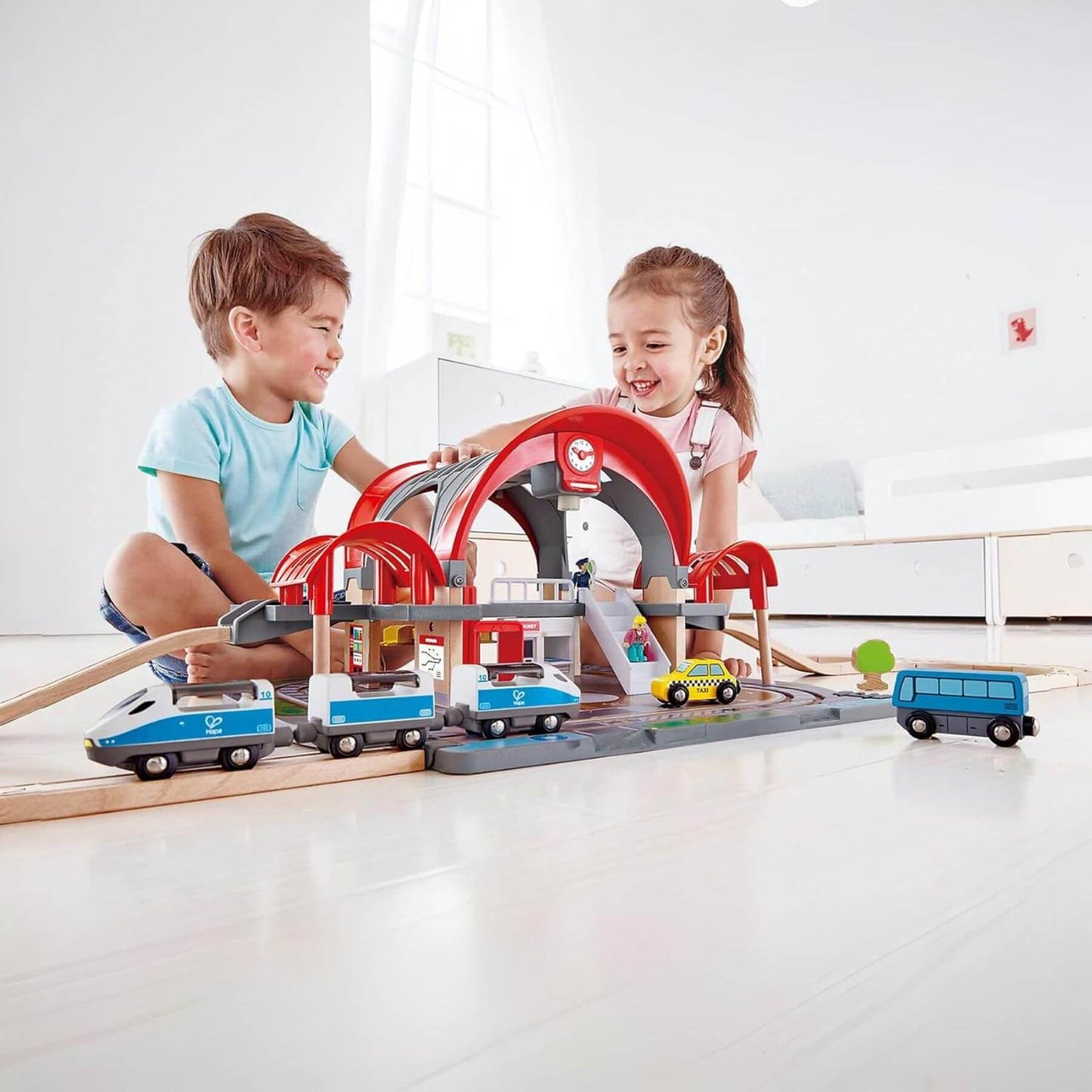 Kids Playing Hape Grand City Station