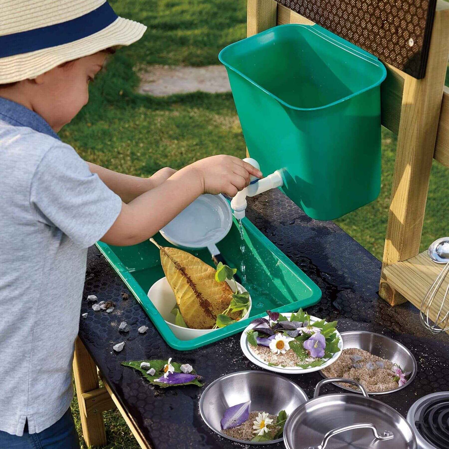Boy Playing at Hape Outdoor Kitchen