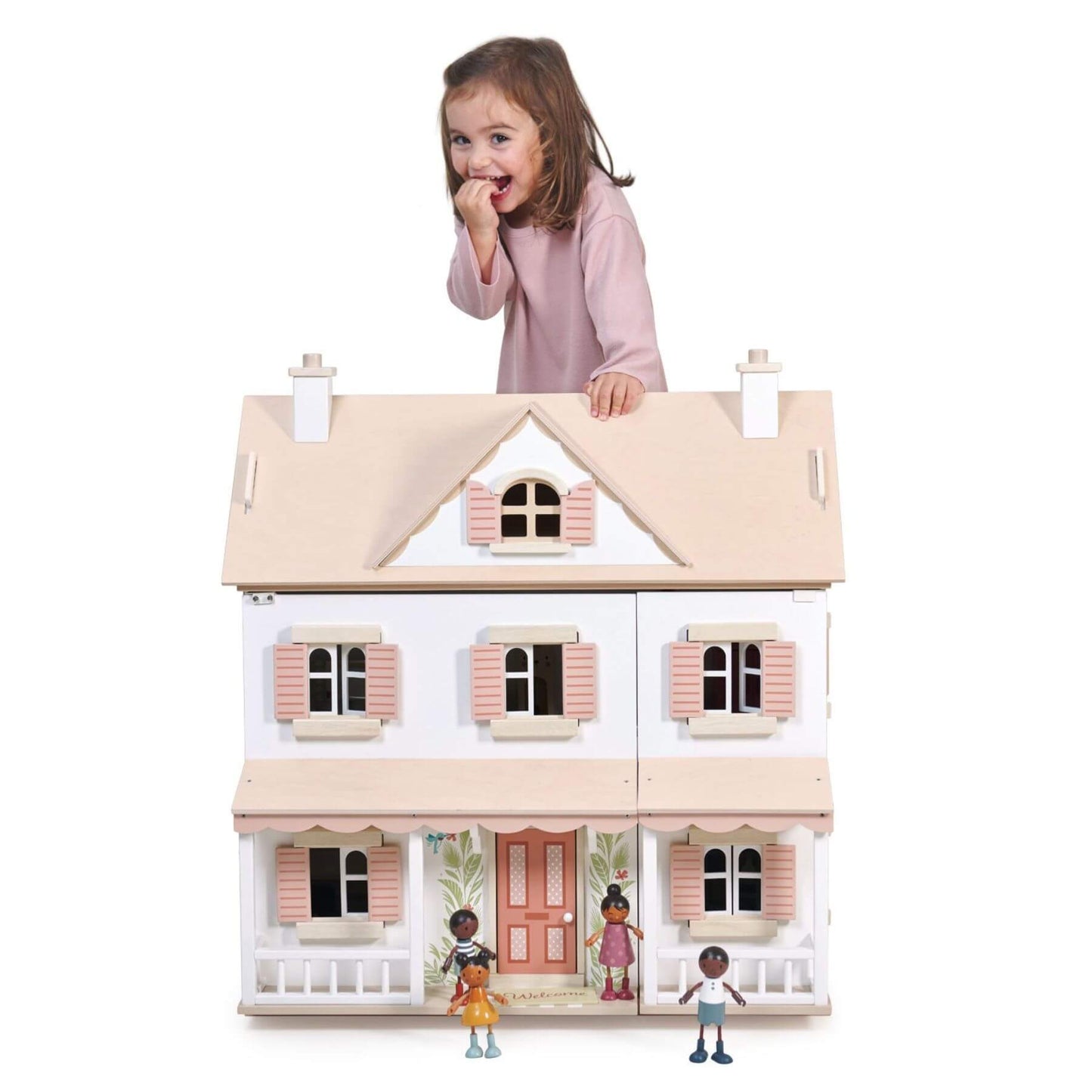 Child playing with Tender Leaf Humming Bird House with miniature figures on a white background