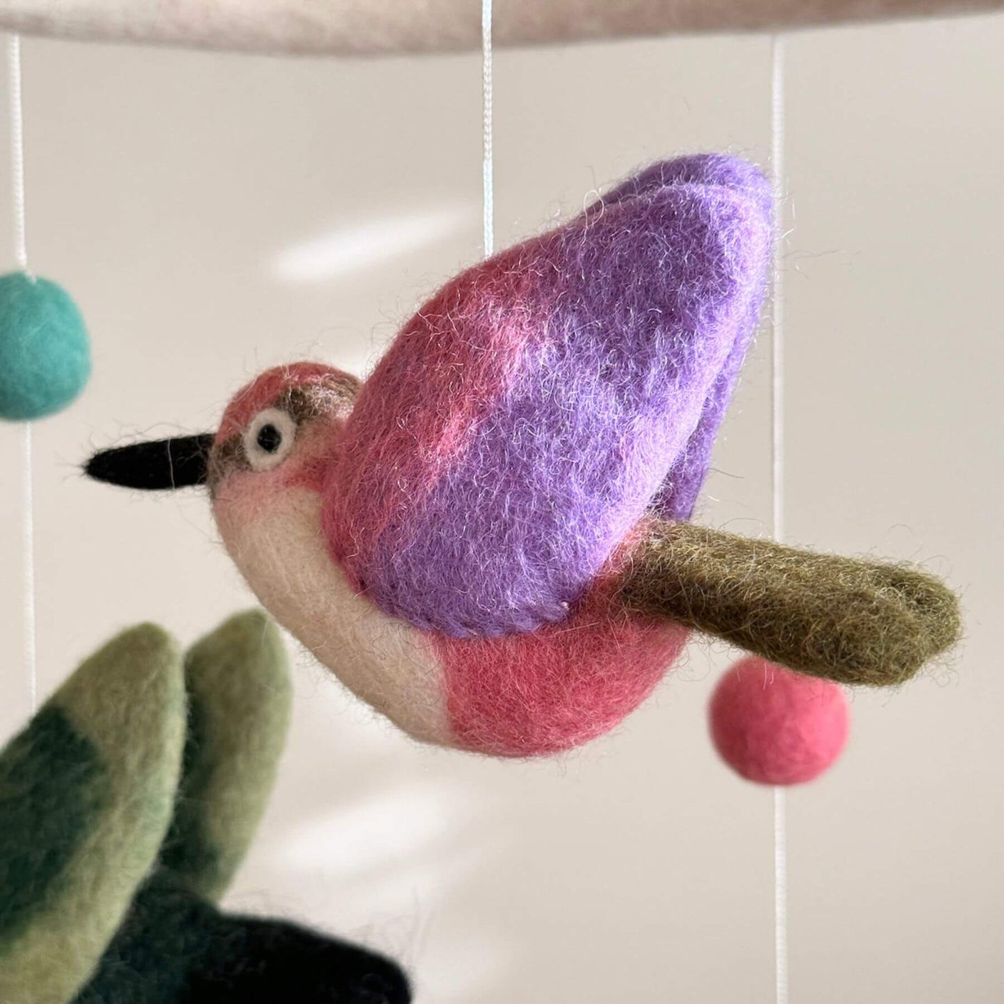 Close-up of Ganapati Crafts Co. Hummingbird Baby Mobile